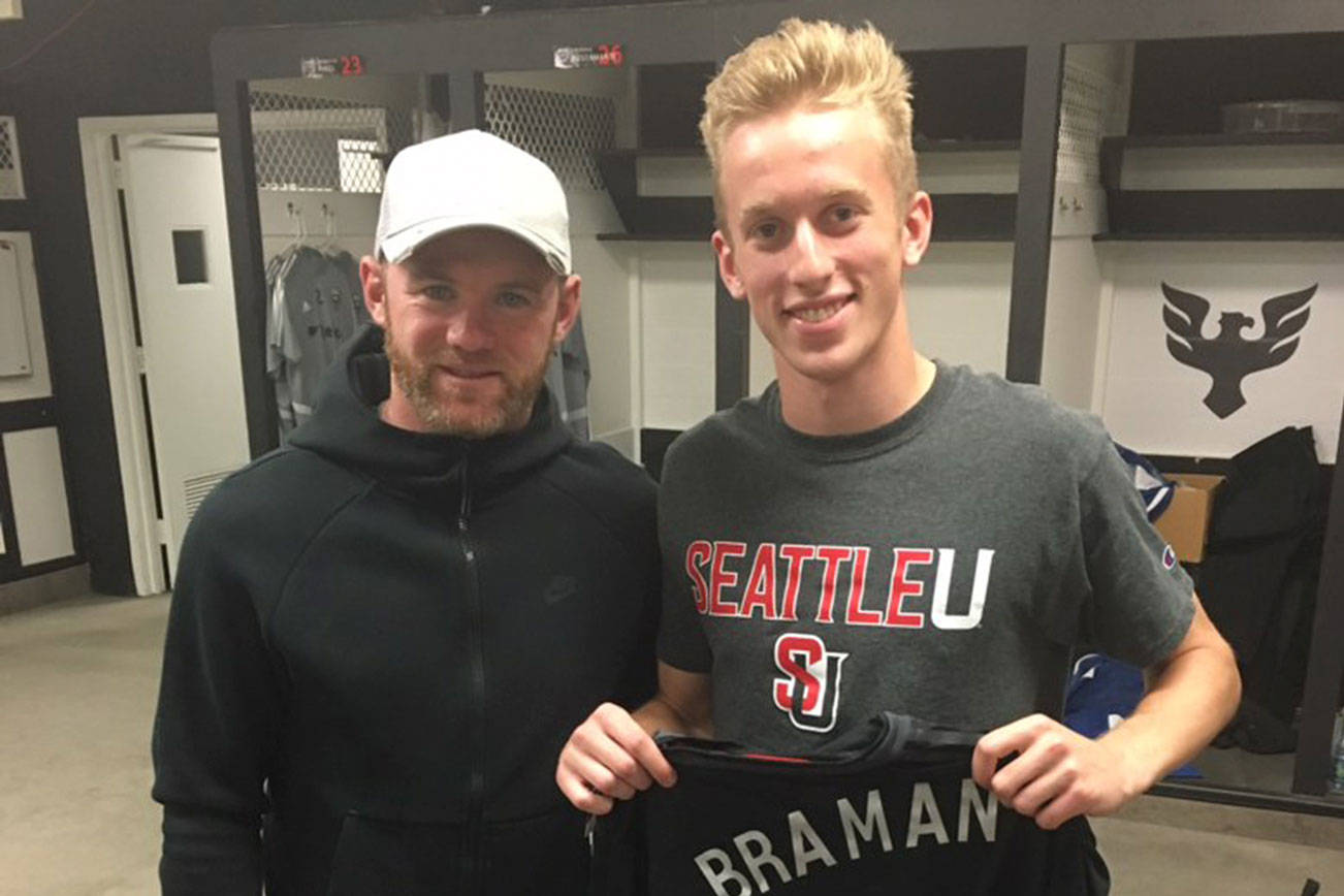 Mercer Island High School 2019 graduate Adam Braman, right, poses for a picture with professional soccer player Wayne Rooney earlier this year. Braman earned the Steve Newman Spirit award in 2019. Photo courtesy of Adam Braman