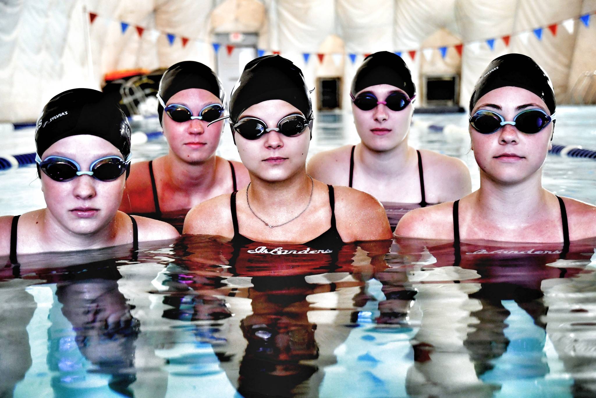 Chauntelle Johnson returns as head coach for the Mercer Island High School girls swim and dive team this season. Johnson was head coach for both the MIHS girls and boys teams several years ago when she helped the girls team to five state titles and the boys team to three state titles. The girls captains this year are (pictured): Ellie Bailey, Kate Hamilton, Grace Olsen and Hailey Vandenbosch for swim, and Sophie McGuffin for the diving group. Photo courtesy of Allison Nelson