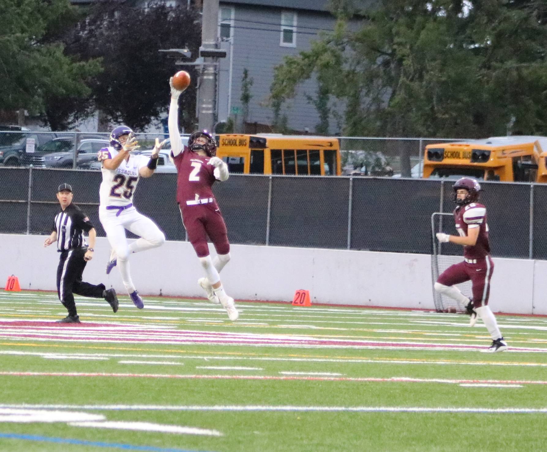 Islanders defensive back Ethan Boyle makes a one-handed interception in the first quarter of their 12-3 loss to Issaquah. Benjamin Olson/ staff photo