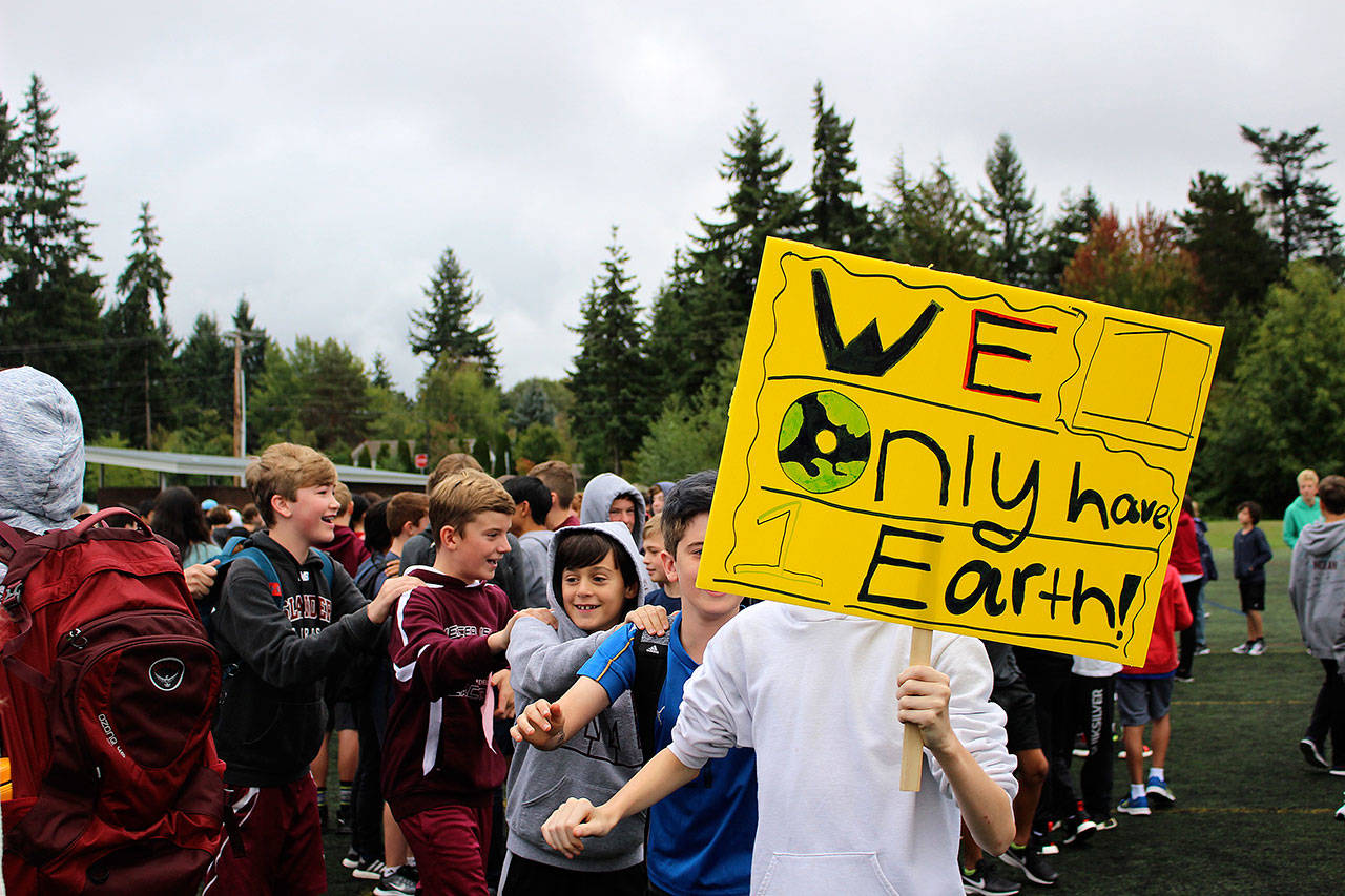 Photo by Madison Miller / staff photo                                Students held signs of “We only have 1 Earth” at Friday’s climate strike at IMS.