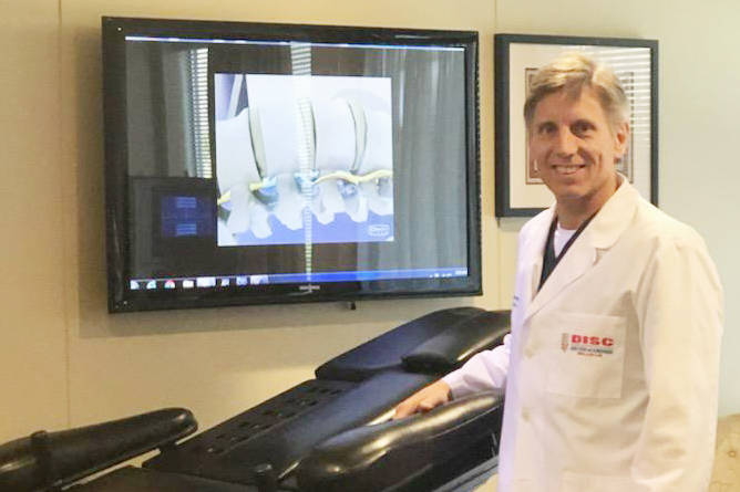 Chiropractor Dr. Steven Thain, DC, is using laser in a non-surgical treatment of pain at the Disc Centers of America in Bellevue.