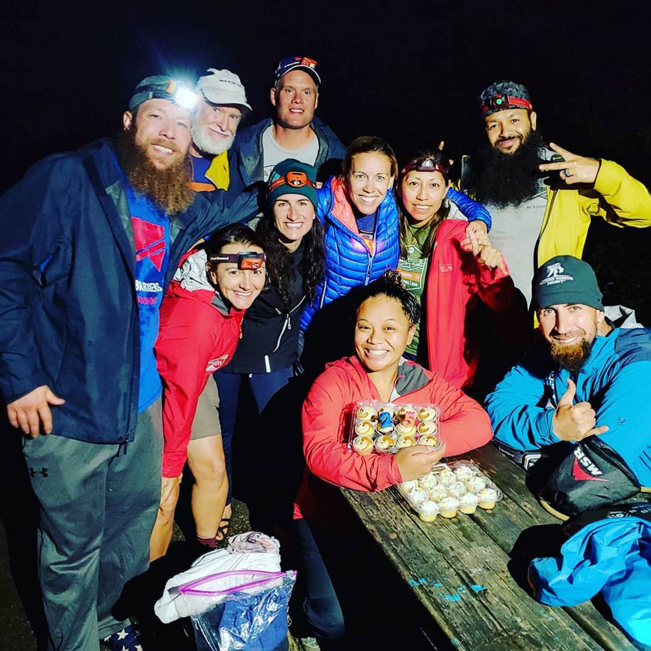 Photo courtesy of Naomi Layco                                Members of the Mt. Baker expedition team surprise Naomi Layco (center) with cupcakes for her 33rd birthday, before their big climb.