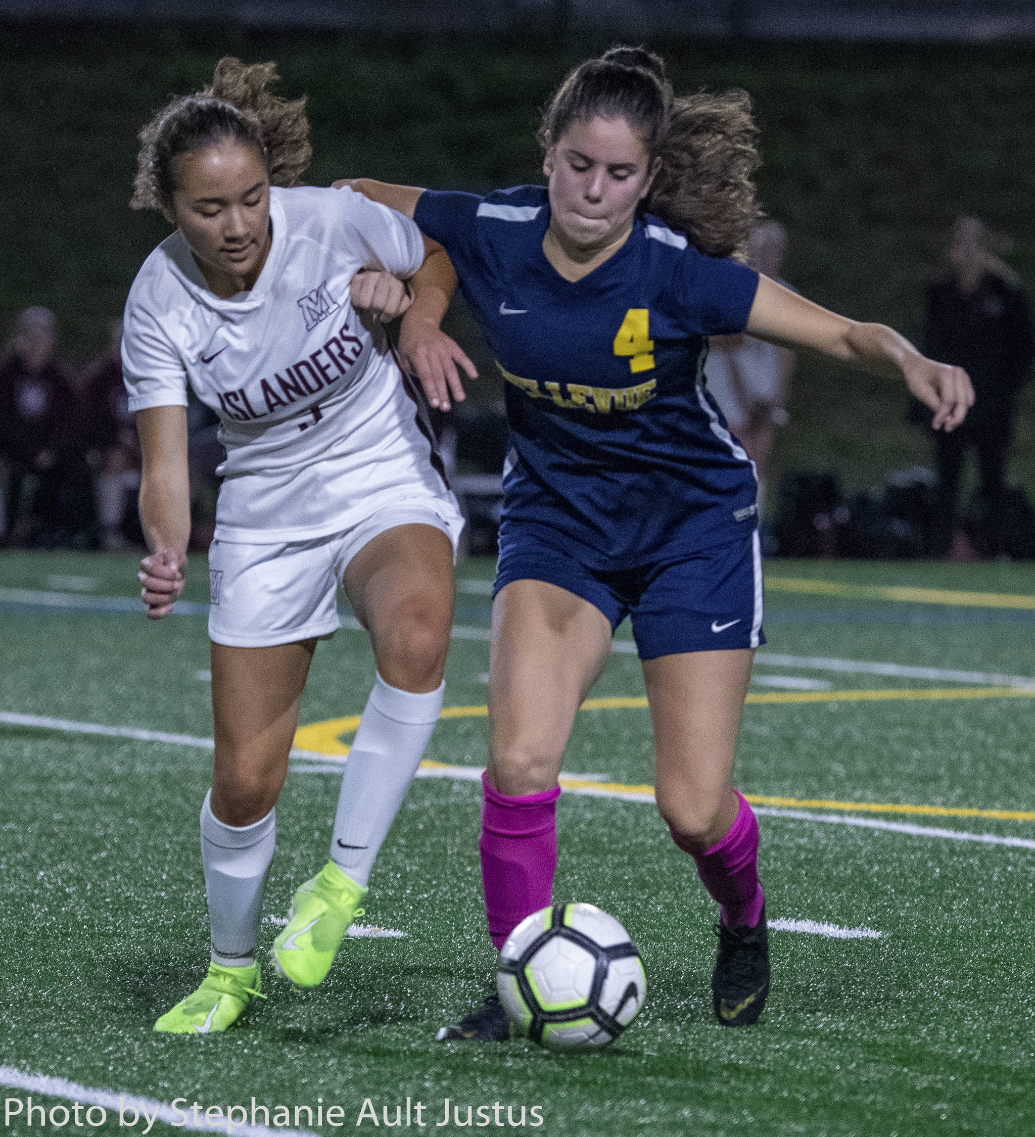 Mercer Island midfielder Emily Yang (left) and Bellevue midfielder Audrey Miller (right) fight for the ball during a 1-1 draw on Oct. 7. Yang scored the lone goal for the Islanders in the tie. Photo courtesy of Stephanie Ault Justus