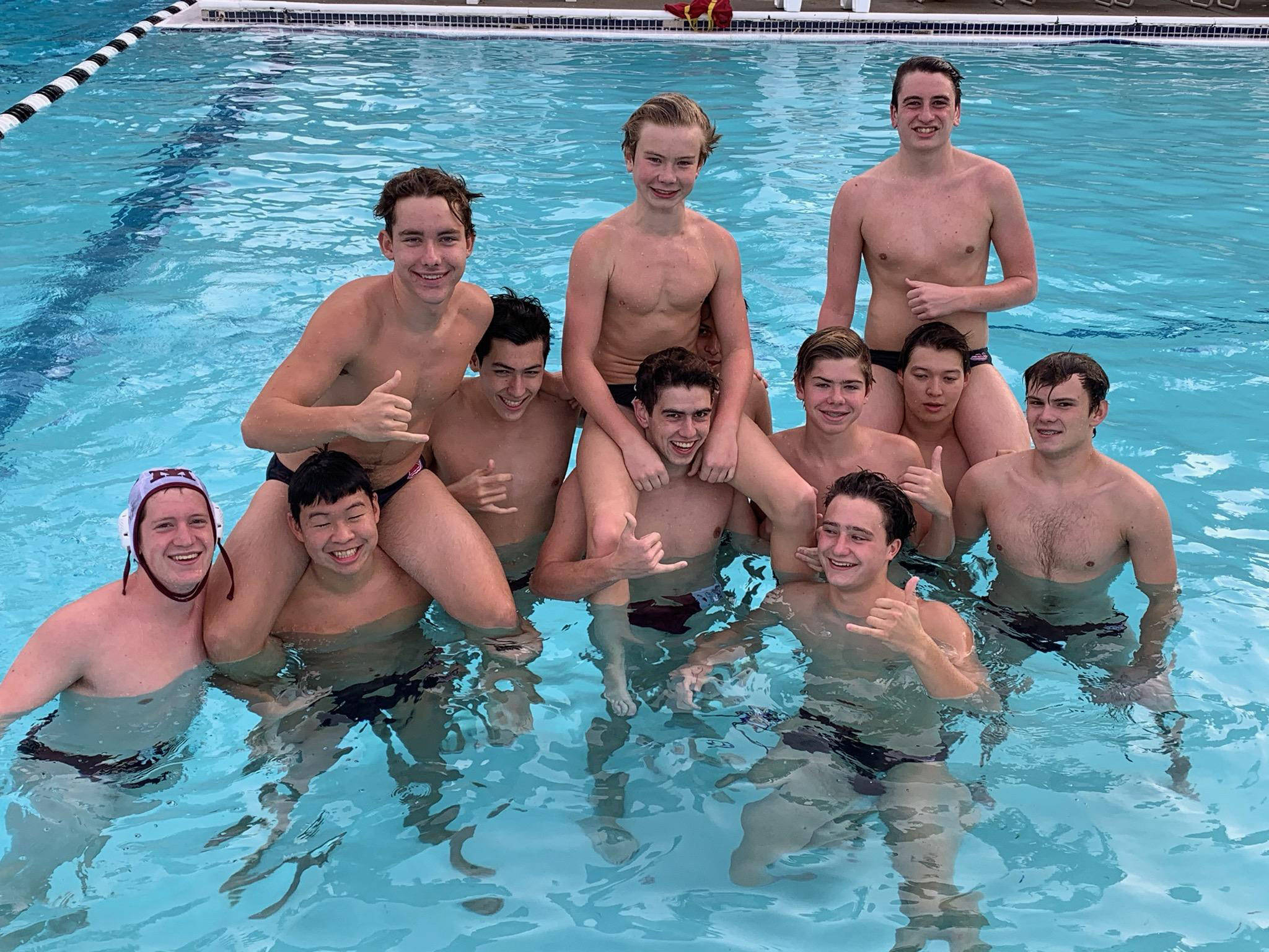 The Mercer Island boys water polo team celebrates after an 11-9 victory over Newport on Oct. 14. Photo courtesy of Chris Vacca