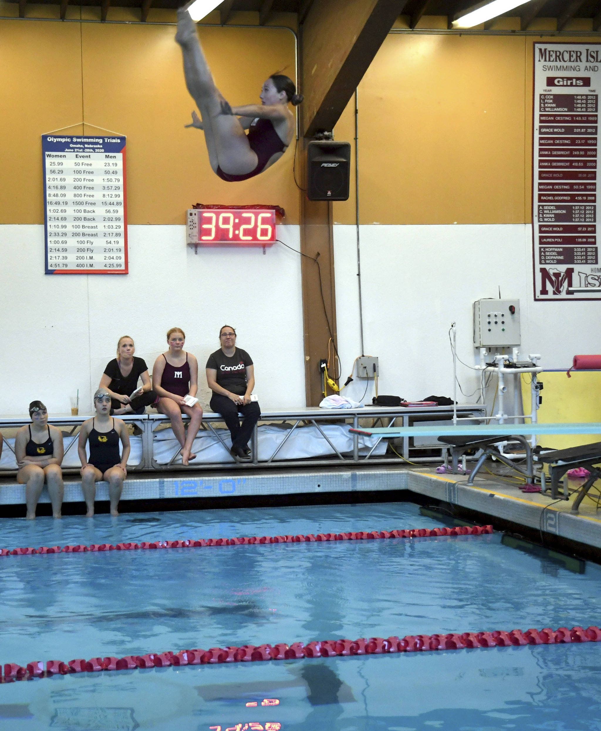 Mercer Island freshman Brooke Andrews dives into the pool during a meet against Bellevue at Mary Wayte Pool on Oct. 10. Photo courtesy of Allison Nelson