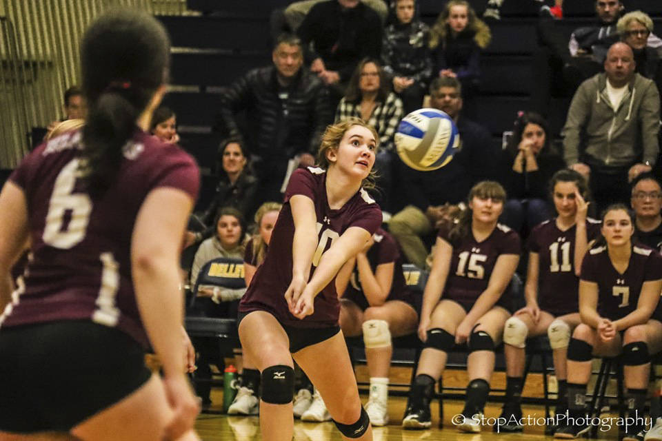 Mercer Island outside hitter Anna Perry (10) hits the ball during the Islanders’ 3-2 victory over Bellevue on Oct. 30. Photo courtesy of Don Borin/Stop Action Photography