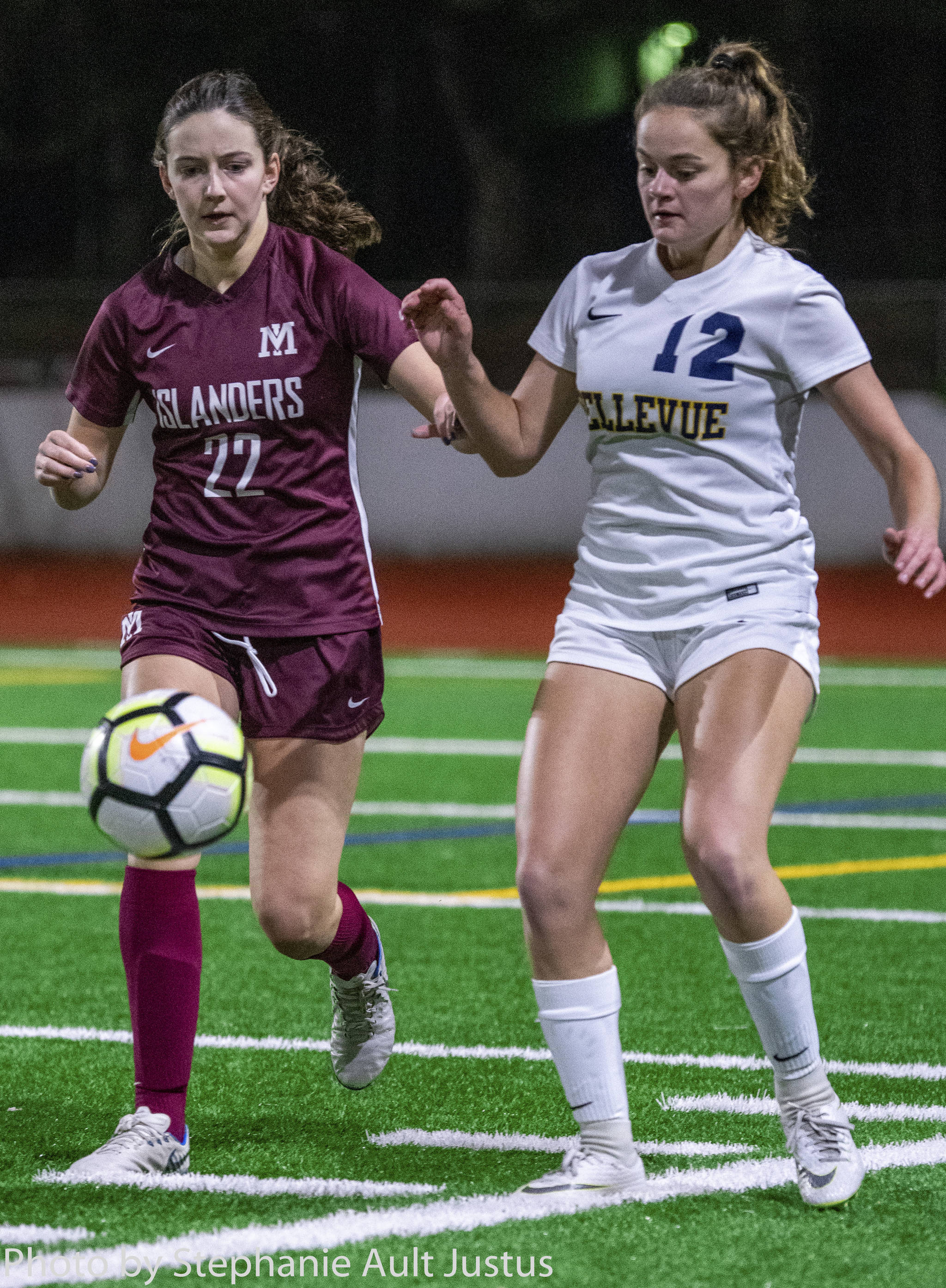 Mercer Island defender Scarlett Counihan (22) and Bellevue midfielder Morgan Pingree (12) both go for the ball during the Wolverines’ 3-0 win on Oct. 31. Photo courtesy of Stephanie Ault Justus