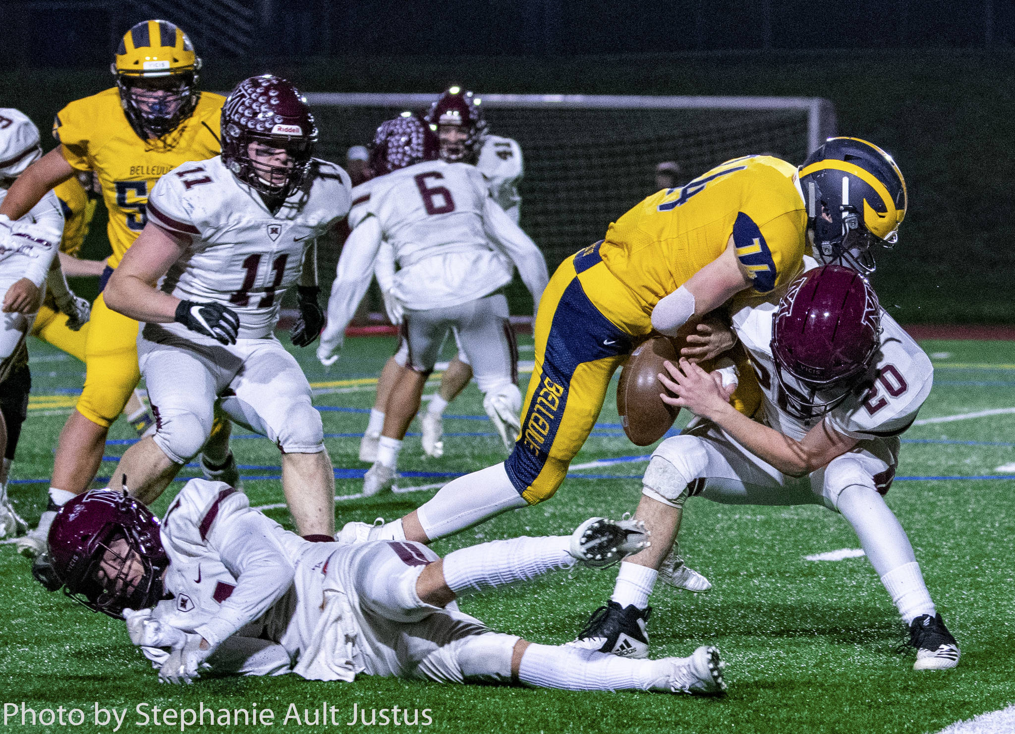 Mercer Island defensive back Carter Burr (20) forces Bellevue running back Alex Reid (14) to fumble the ball at the 1-yard line on Nov. 1. Photo courtesy of Stephanie Ault Justus