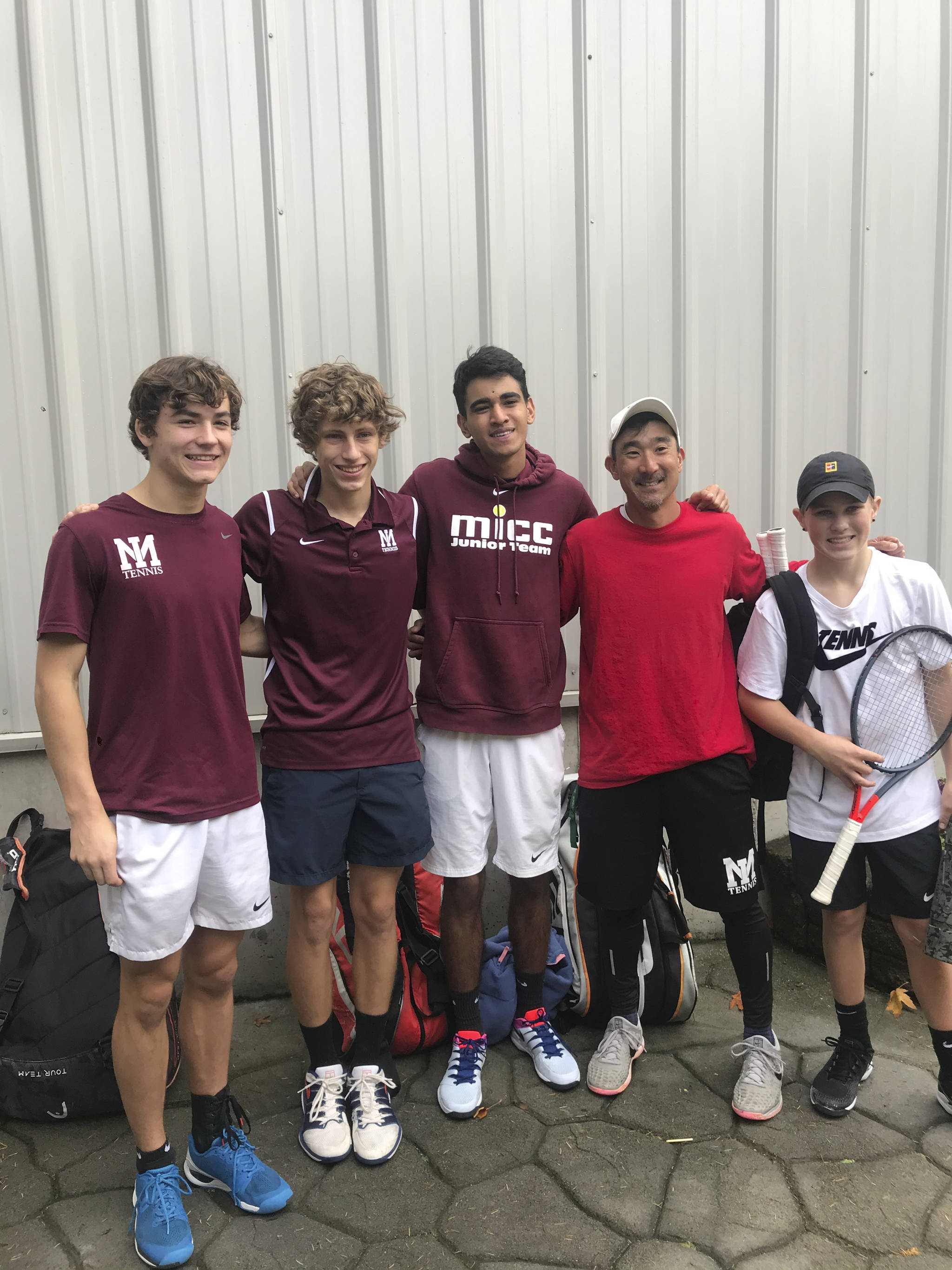 Members of the Mercer Island boys tennis team, (from left) Jack Mattox, Andrew Kaelin, Alex Patel, head coach Ryan Pang and Brock Anderson, gather at the 3A KingCo league tournament. Photo courtesy of Steve Mattox