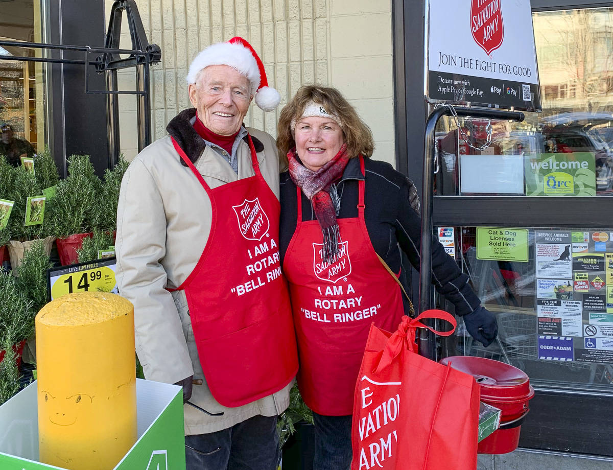 Courtesy photo                                 Mercer Island Rotary Club members Bruce McAuley and Karolyn Streck volunteering as bell ringers for the Salvation Army.
