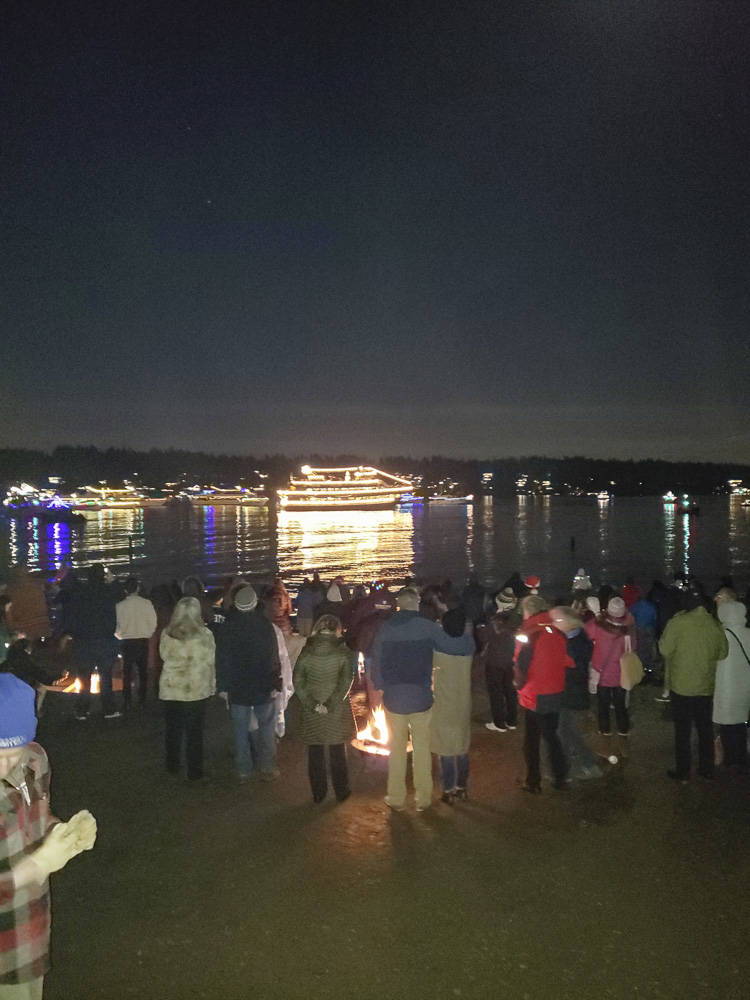Beachgoers at Luther Burbank Park on Mercer Island enjoy a previous year’s performance of the Argosy Cruises Christmas Ship Festival. Courtesy photo