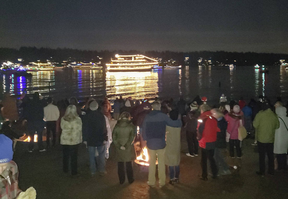 Beachgoers at Luther Burbank Park on Mercer Island enjoy a previous year’s performance of the Argosy Cruises Christmas Ship Festival. Courtesy photo