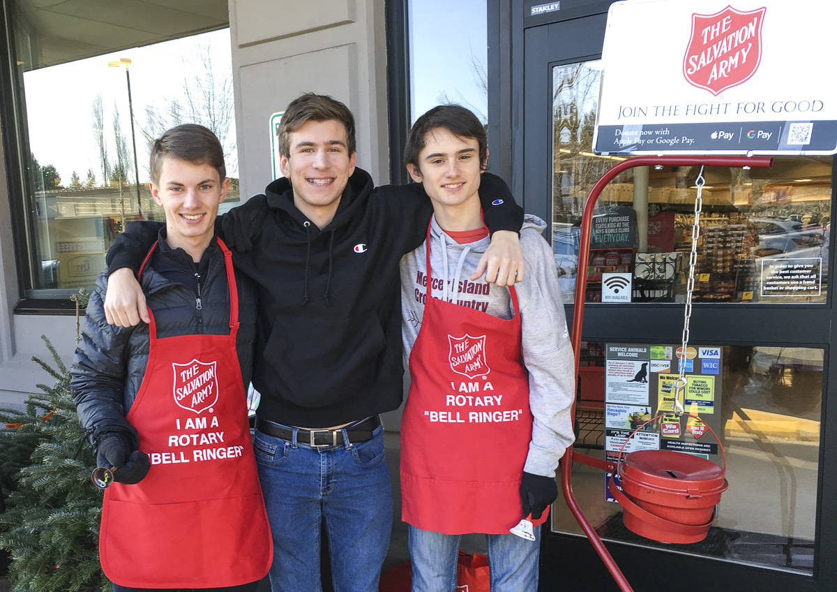 Mercer Island High School Interact Club members participated in bell ringing for Salvation Army with the Rotary Club of Mercer Island in late November and December 2019. From left: Charles Wischman, Peyton Rapo and Mathis Destouches. Courtesy photo.