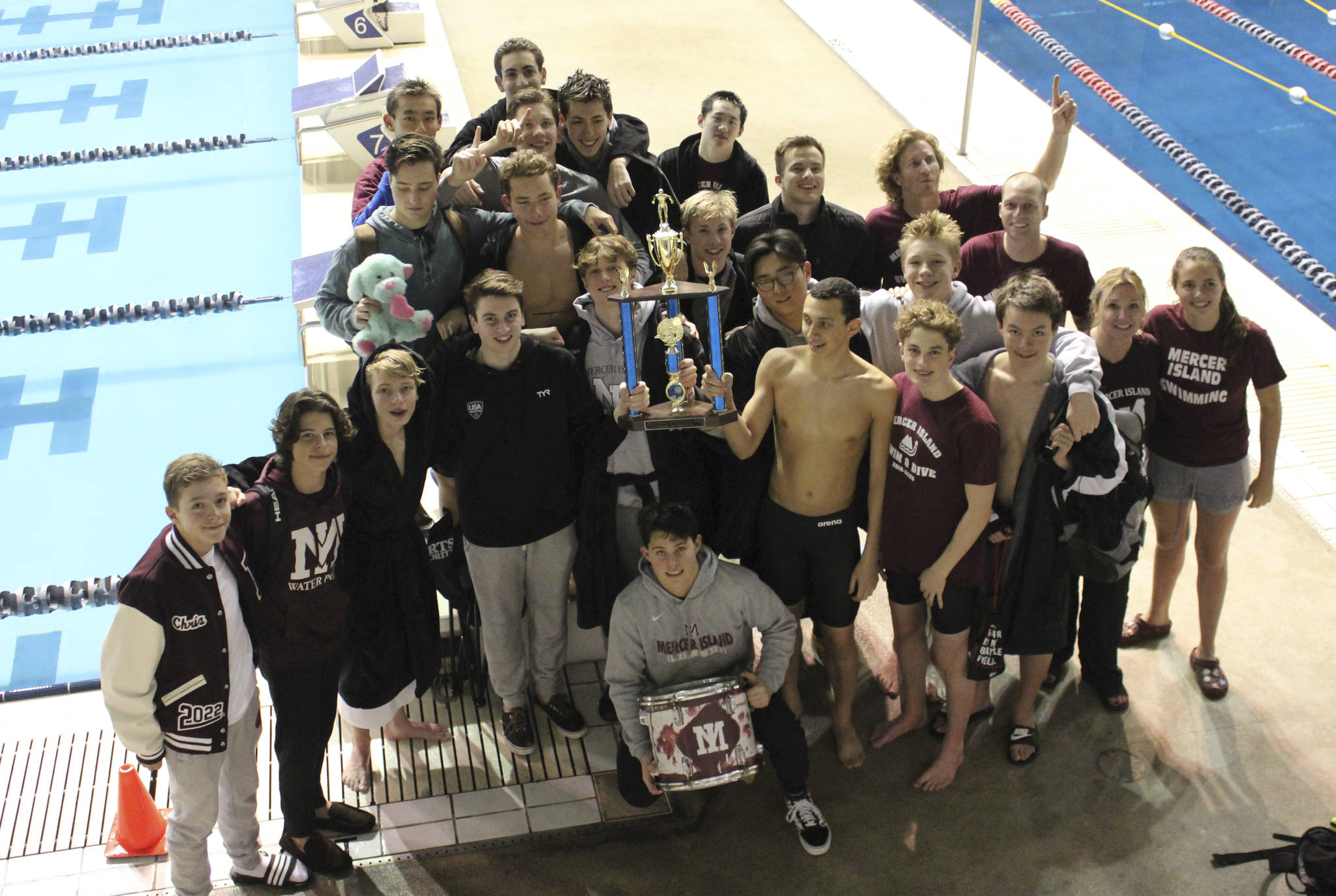 The Mercer Island boys swim and dive team celebrates with the Kentridge Invitational trophy after finishing first as a team on Jan. 11 in Federal Way. Courtesy photo