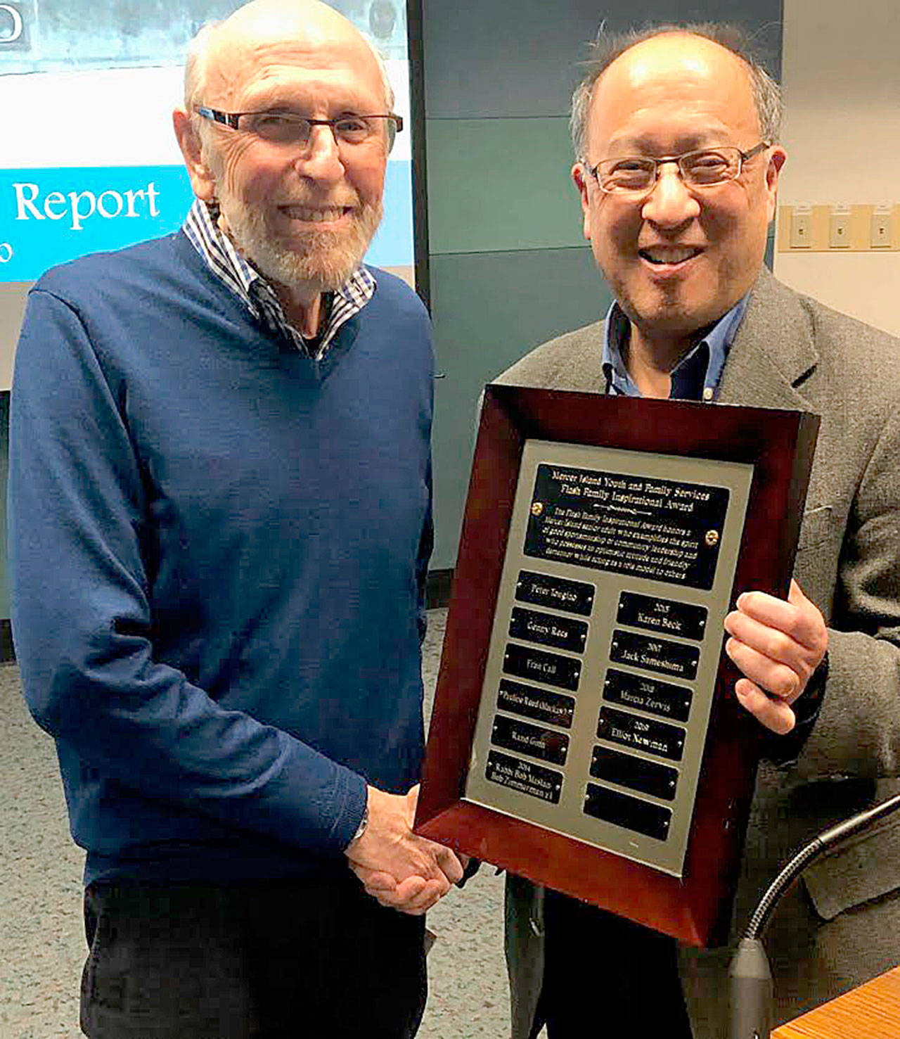 Courtesy photo                                Elliot Newman (left) receives his MIYFS Family Inspirational Award from Mayor Wong on Jan. 7.