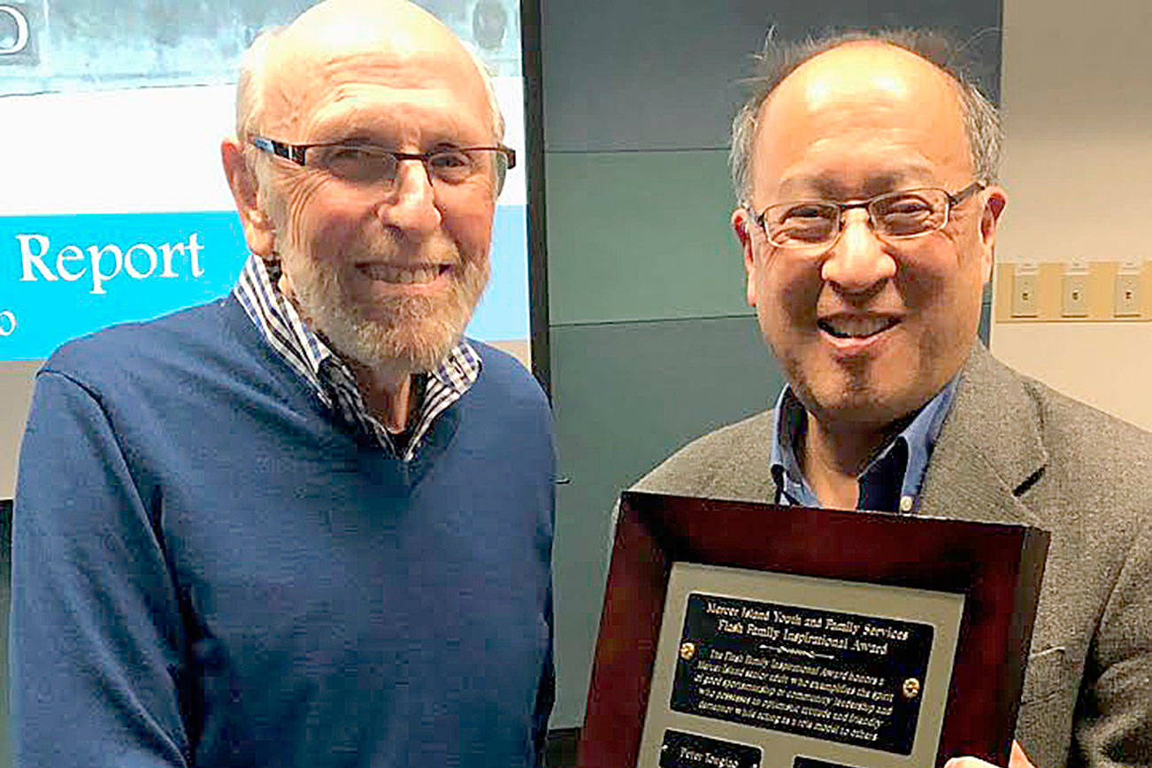 Courtesy photo                                Elliot Newman (left) receives his MIYFS Family Inspirational Award from Mayor Wong on Jan. 7.