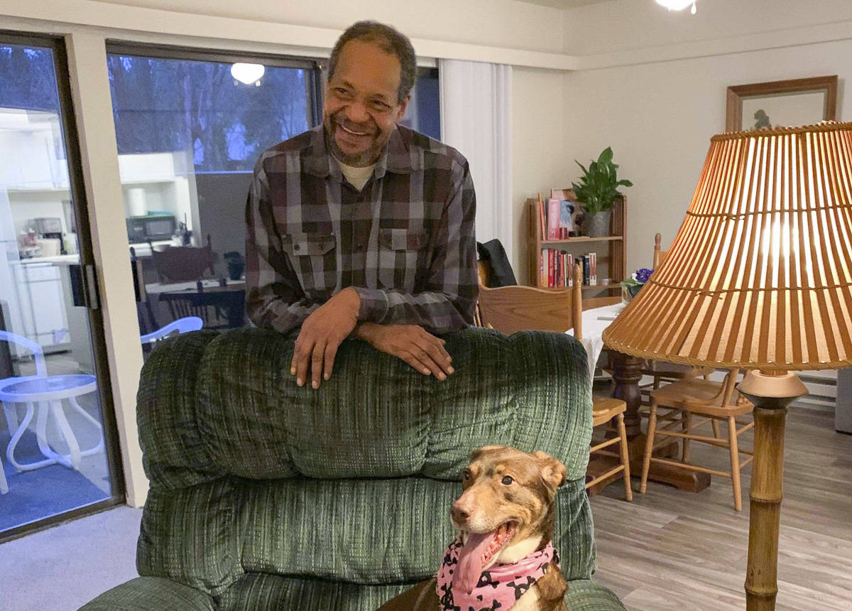 Alan Roach and his dog, Roxie, reunited in their new apartment. Natalie DeFord/staff photo