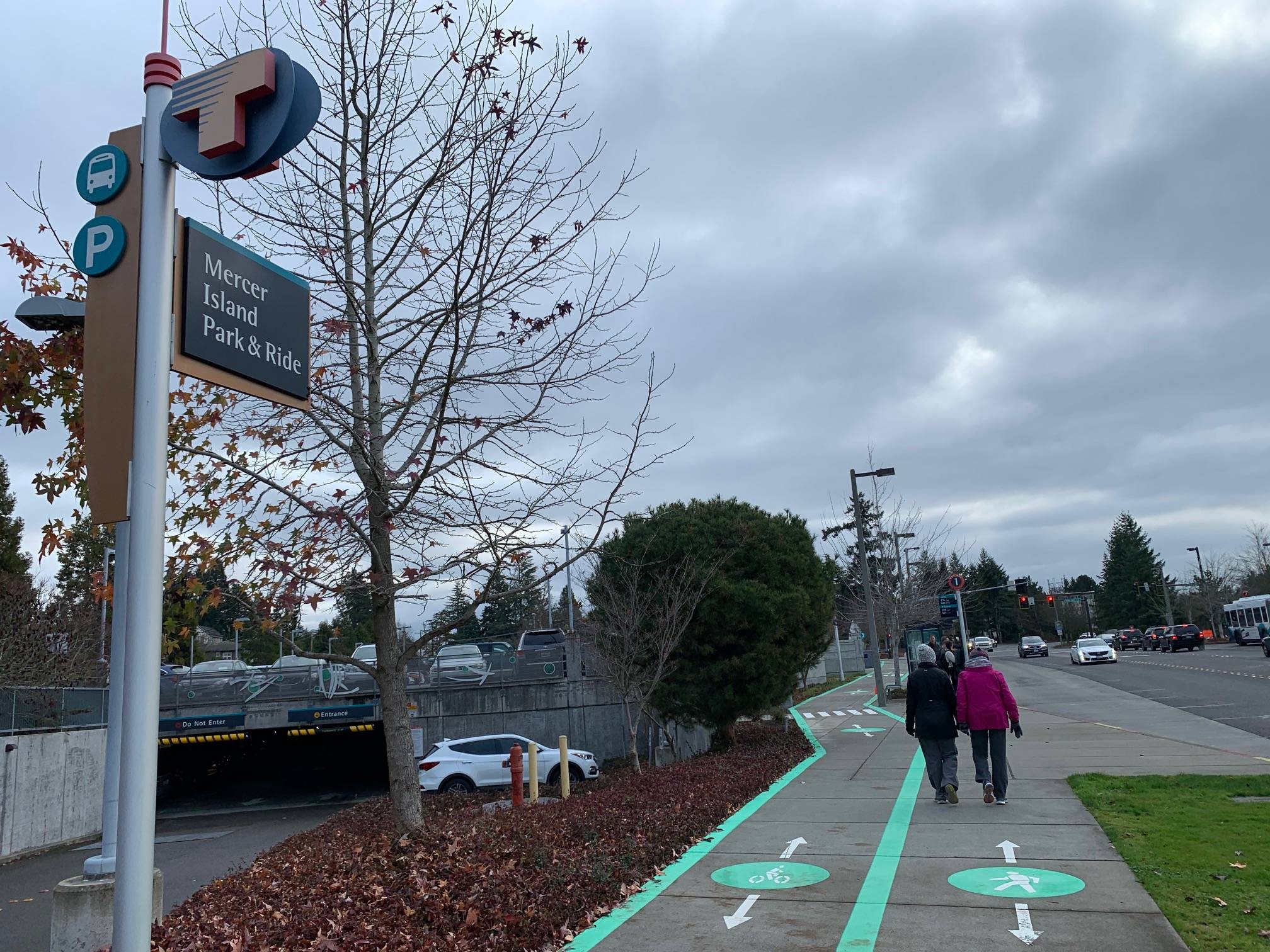 Natalie DeFord / staff photo                                People walk past the Mercer Island Park and Ride on a cloudy morning.