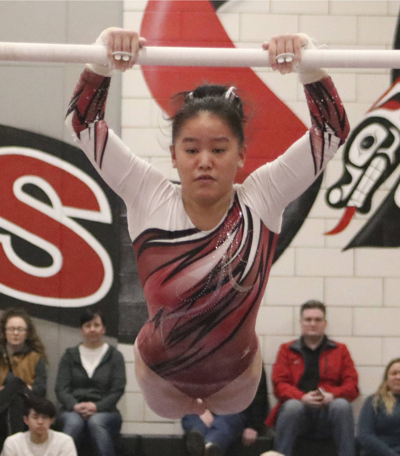 Mercer Island’s Rachel Ressmeyer jumps onto the high bar during the event finals at the 1A/2A/3A state gymnastics meet on Feb. 21. Benjamin Olson/staff photo