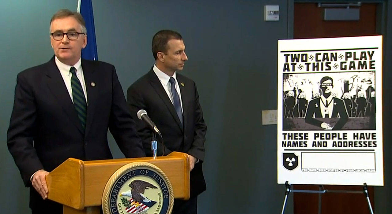 U.S. Attorney Brian T. Moran (left) and FBI special agent in charge Raymond Duda spoke at a press conference in Seattle on Feb. 26. Screenshot from King 5 live stream