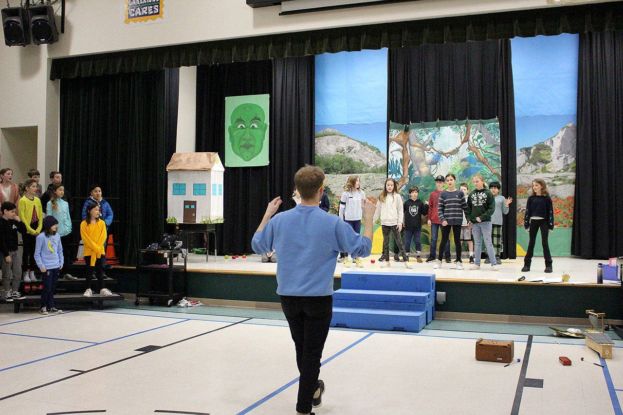 Music teacher Tyler Stevens rehearses the fifth-grade operetta on Feb. 28. Madison Miller/staff photo