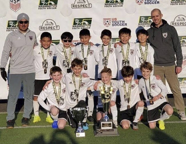 The Mercer Island Football Club’s boys 2009 team coached by Aaron Byers won the gold level championship at the Washington Youth Soccer Founders Cup Tournament. Courtesy photo