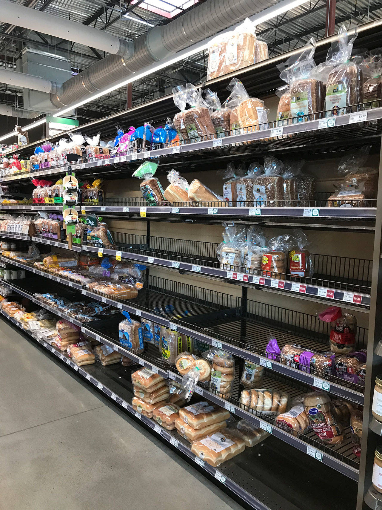 Sections of the bread aisle at the Whole Foods in Kirkland were cleared out on March 15. Samantha Pak/staff photo