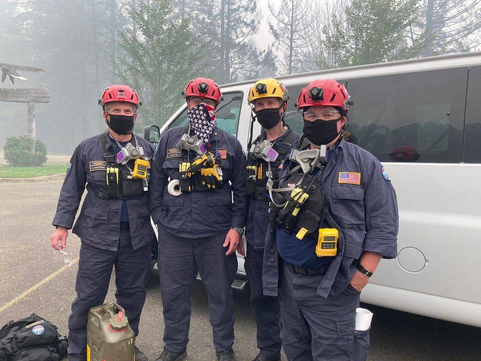 Five Mercer Island Fire Department members were part of the 70-member Federal Emergency Management Agency Urban Search and Rescue team that was recently deployed to southern Oregon to search through the destruction of the Happy Camp fire. Pictured are, left to right: Kent Bastrom, rescue specialist; Tommy Guttu, rescue specialist; Steve McCoy, technical search specialist and canine team safety officer; and Alec Munro, rescue specialist. Not pictured: Shawn Matheson, search team manager. Photo courtesy of the Mercer Island Fire Department