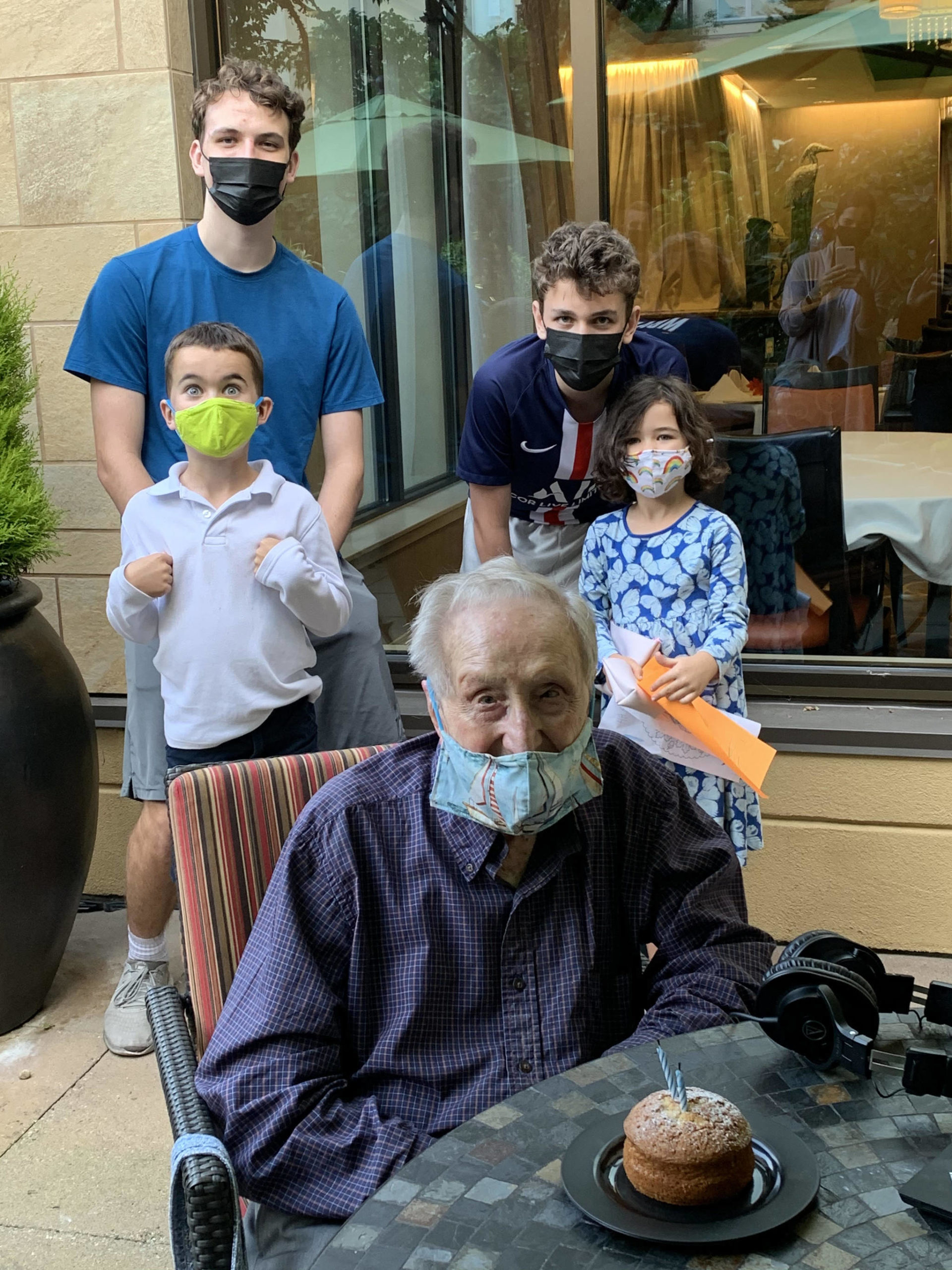 George Dondero celebrates his 107th birthday with four of his 11 great-grandchildren at Aljoya Mercer Island on Oct. 7. In the back are Nick and Lucas Edwards; in front of them are Jack and Harper Flanagan. Courtesy photo