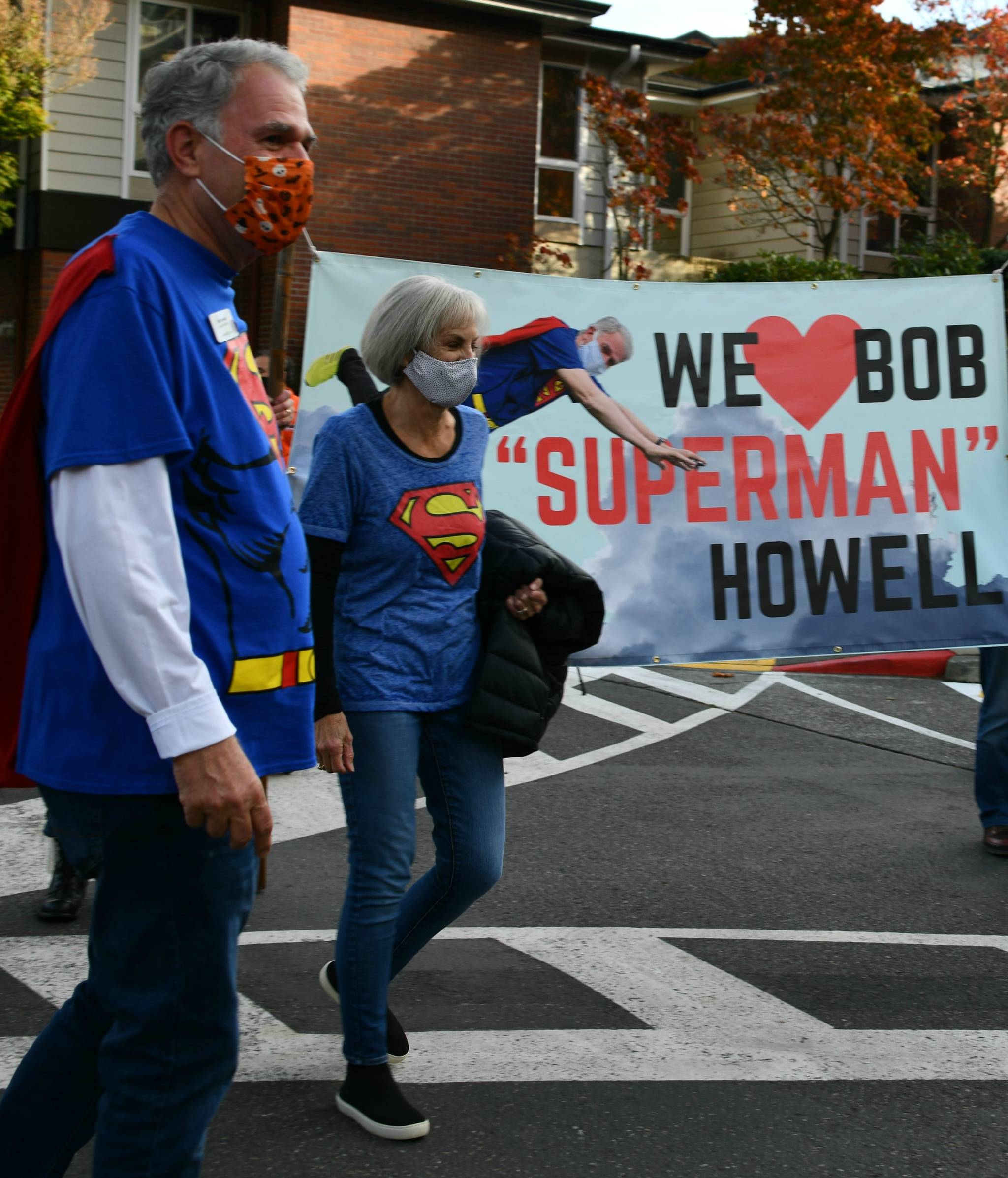 Bob Howell and his wife Patty take part in a parade honoring Bob at Covenant Living at the Shores on Oct. 30. Andy Nystrom/ Reporter