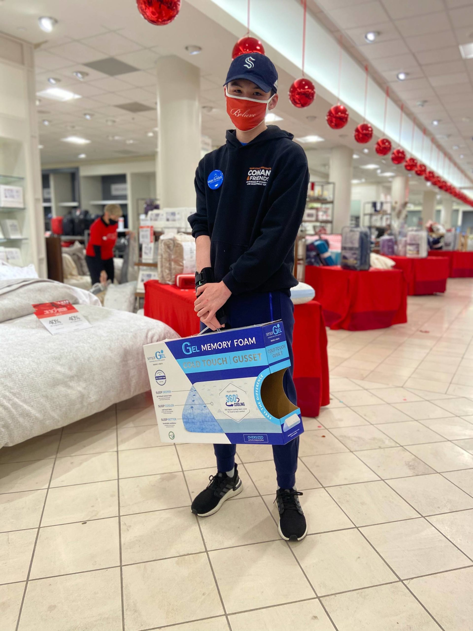 Mercer Island’s Harry McGovern chooses pillows for Seattle Children’s Hospital patients during his Make-A-Wish Alaska and Washington shopping trip at Macy’s in Bellevue on Oct. 31. Photo courtesy of Make-A-Wish Alaska and Washington