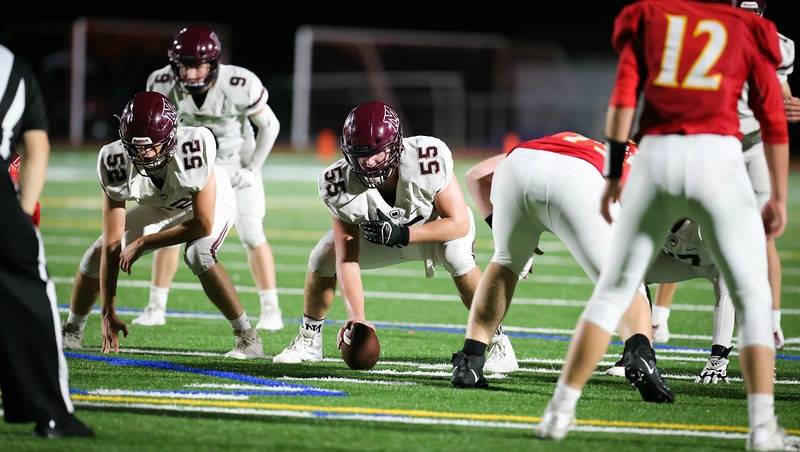 Derek Osman (55) lines up at center for the Mercer Island High School squad last season. Courtesy photo