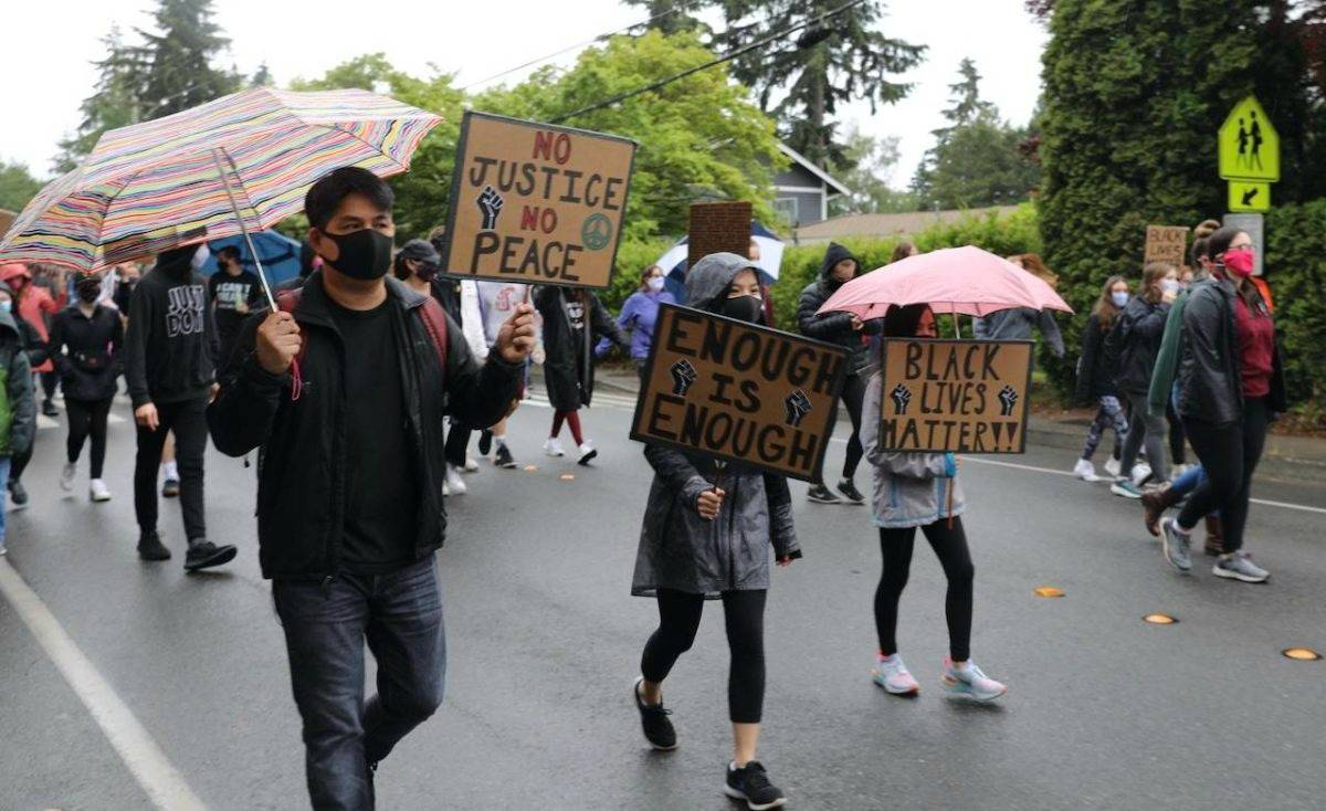 Rainy weather didn’t deter protesters from marching on June 12 to protest the police killing of George Floyd, Breonna Taylor and other black Americans. Blake Peterson/staff photo
