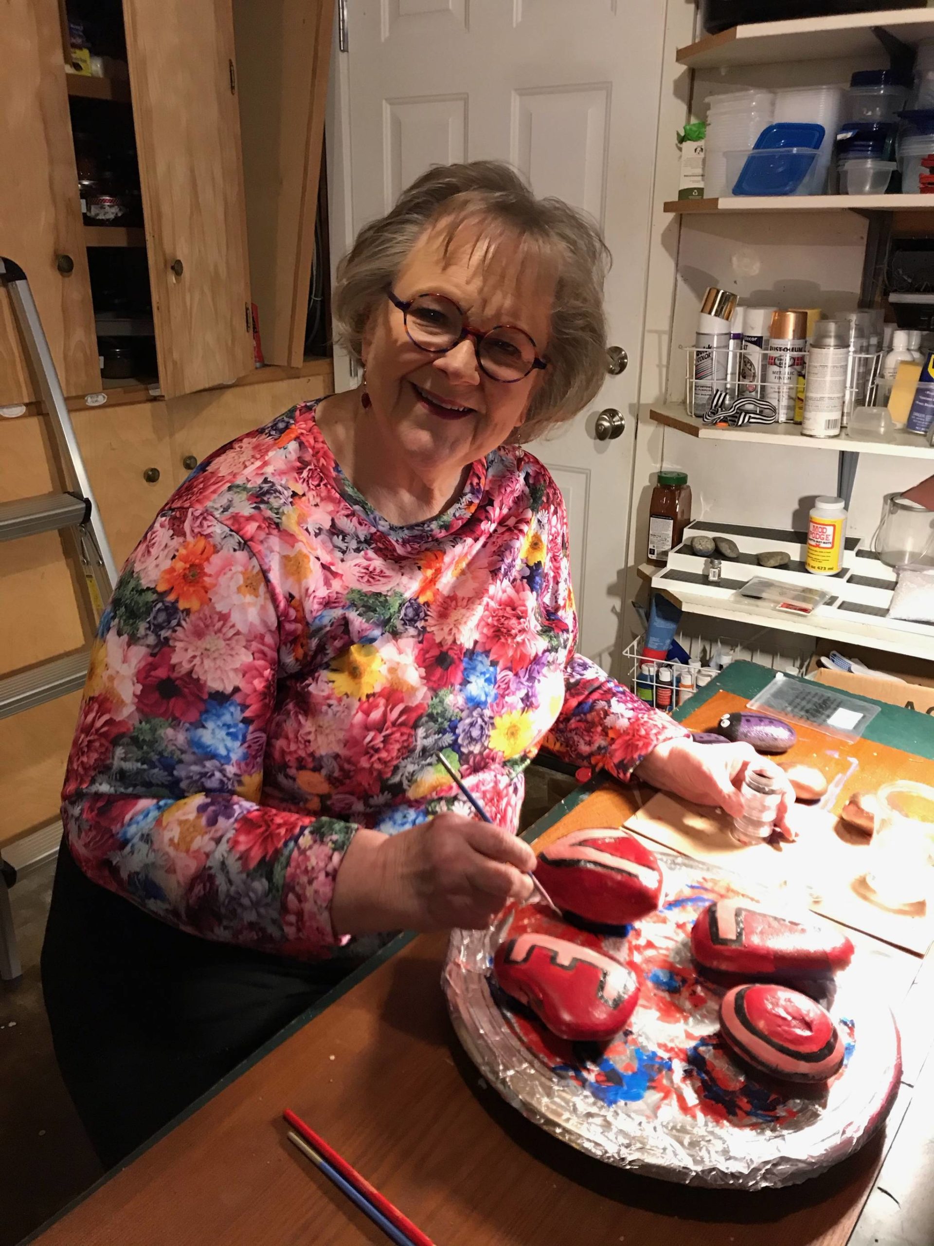 Cindy Soderberg paints hopeful messages on rocks in her home. Courtesy photo