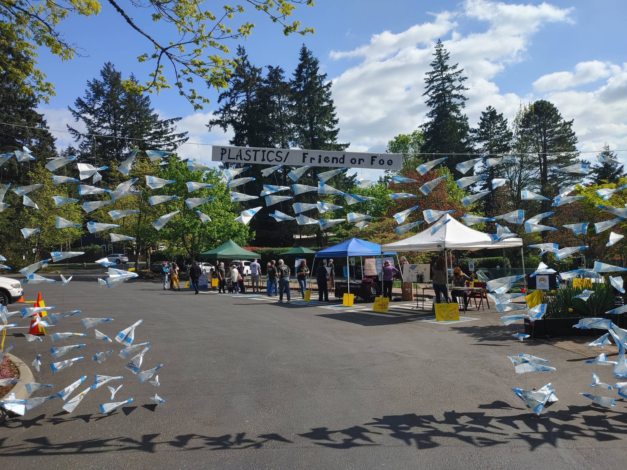 A drive-through art installation made of recycled materials points the way toward the Congregational Church on Mercer Island Earth Day Fair. Andy Nystrom/ staff photo