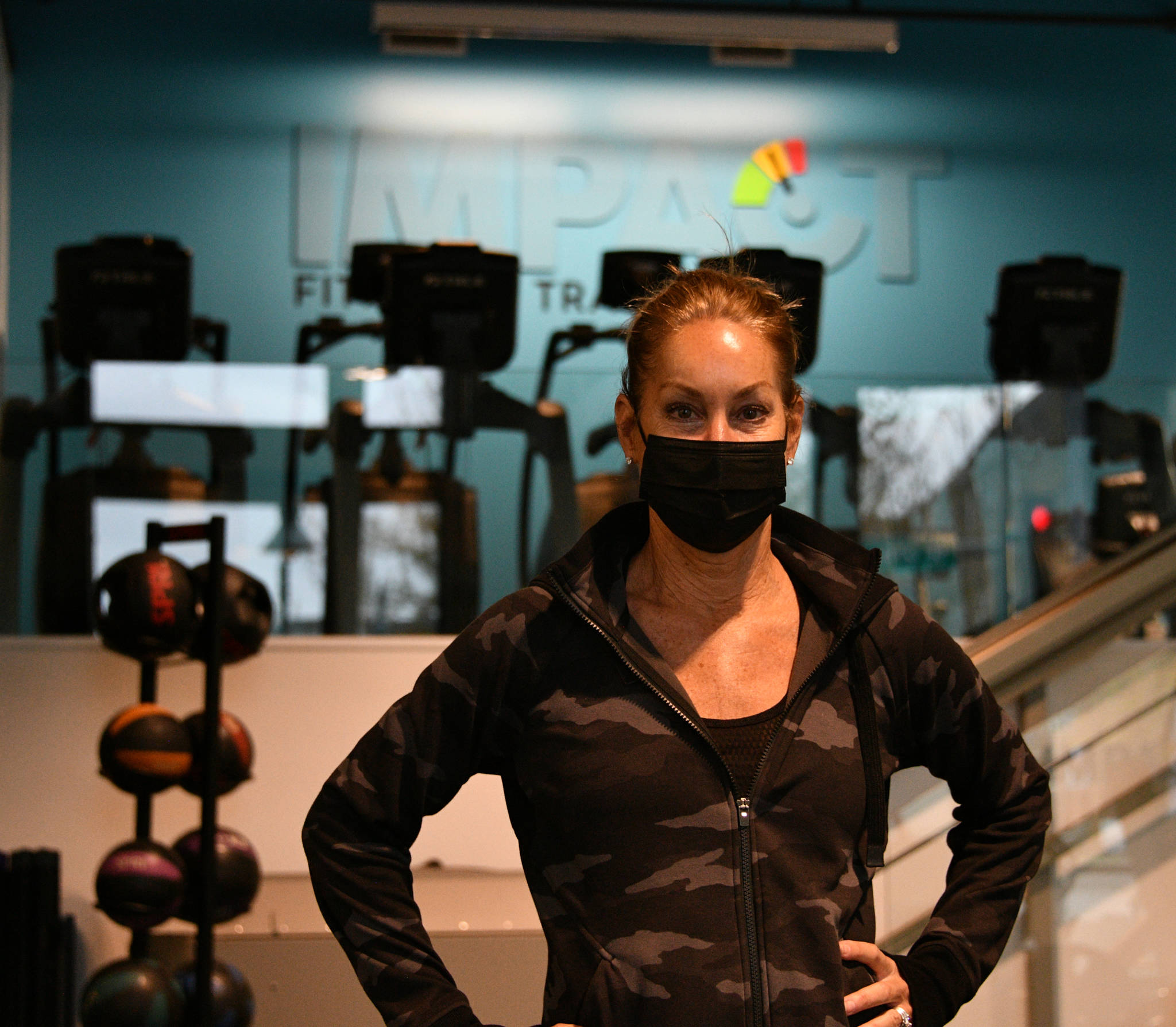 Ginny Pietila stands inside her business, IMPACT Fitness + Training. Andy Nystrom/ staff photo
