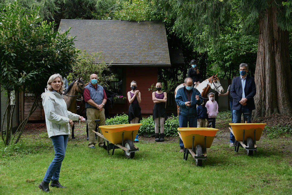 Lisa Thompson speaks to attendees at the groundbreaking ceremony on May 6 for the restoration of the old Lakeview Schoolhouse’s teacher’s cottage, which caught fire in 2018. Andy Nystrom/ staff photo