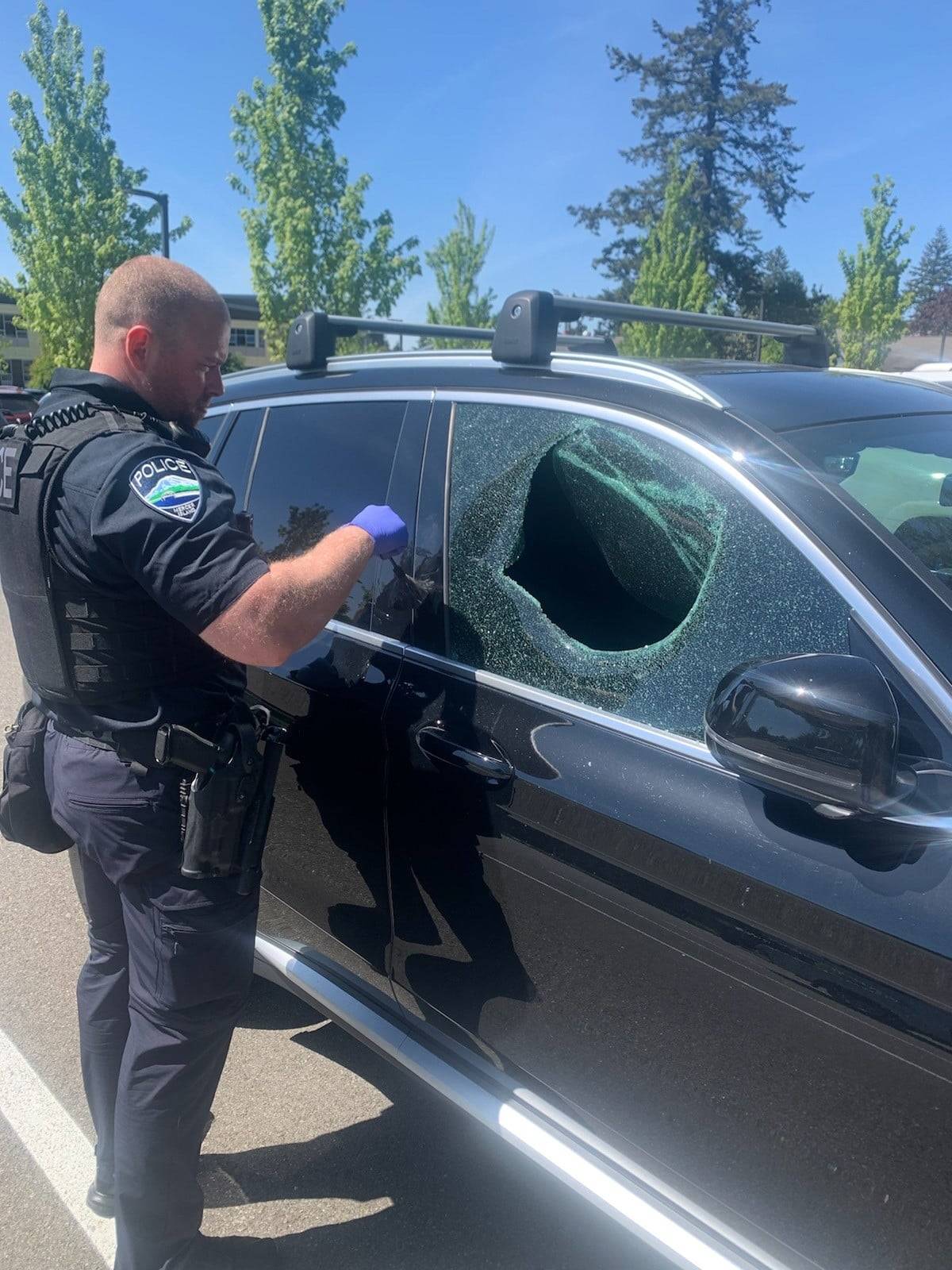 Mercer Island Police Department Officer Lee Tortorelli evaluates a car prowl on a recent day. Photo courtesy of the Mercer Island Police Department