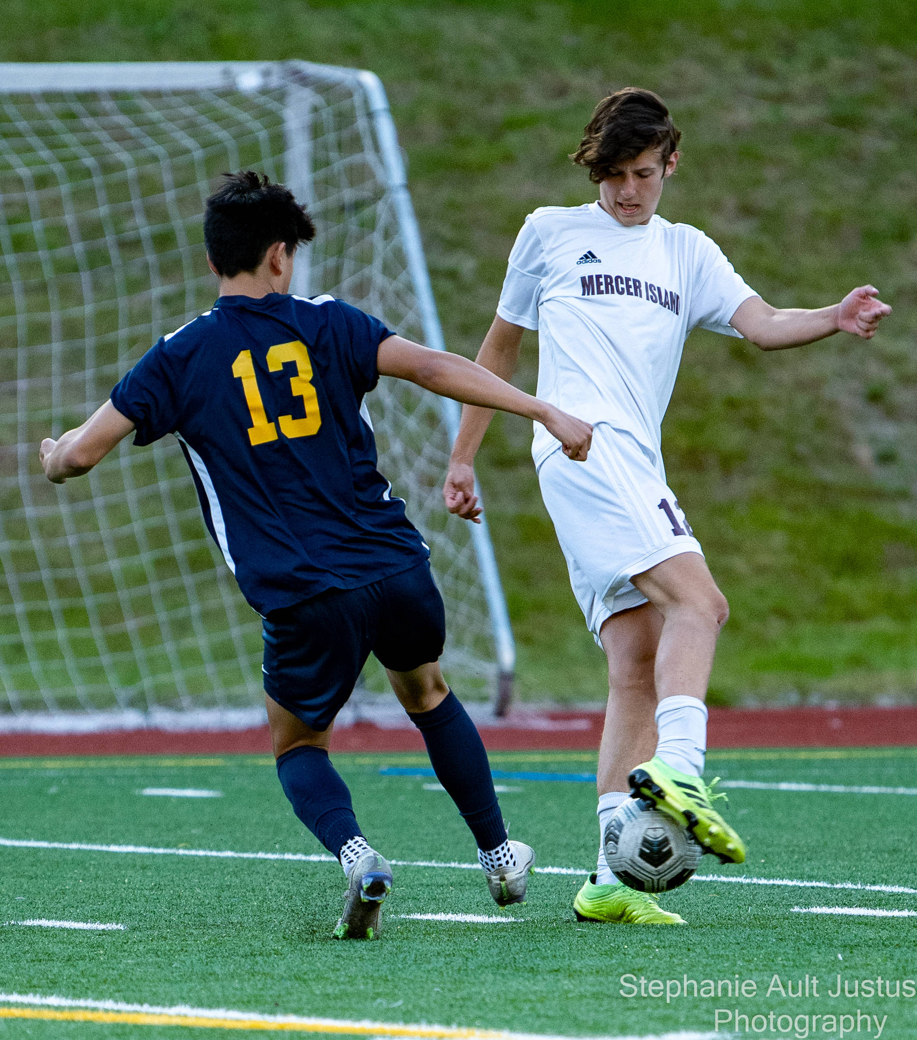 Mercer Island’s Brady Gilroy battles Bellevue’s Jake Chung for the ball in a June 3 match. Mercer Island won, 3-0, on goals from Gilroy, Alec Willet and Tripp White. Photo courtesy of Stephanie Ault Justus