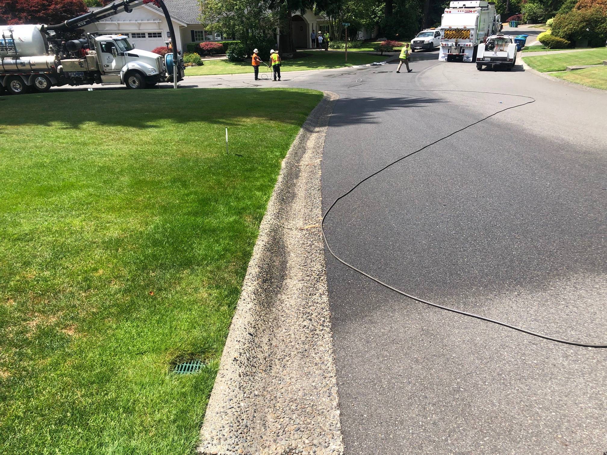 Recology crews clean up leaked hydraulic fluid in the 5400 block of 89th Avenue Southeast on July 8. Photo courtesy of Brian Simmons