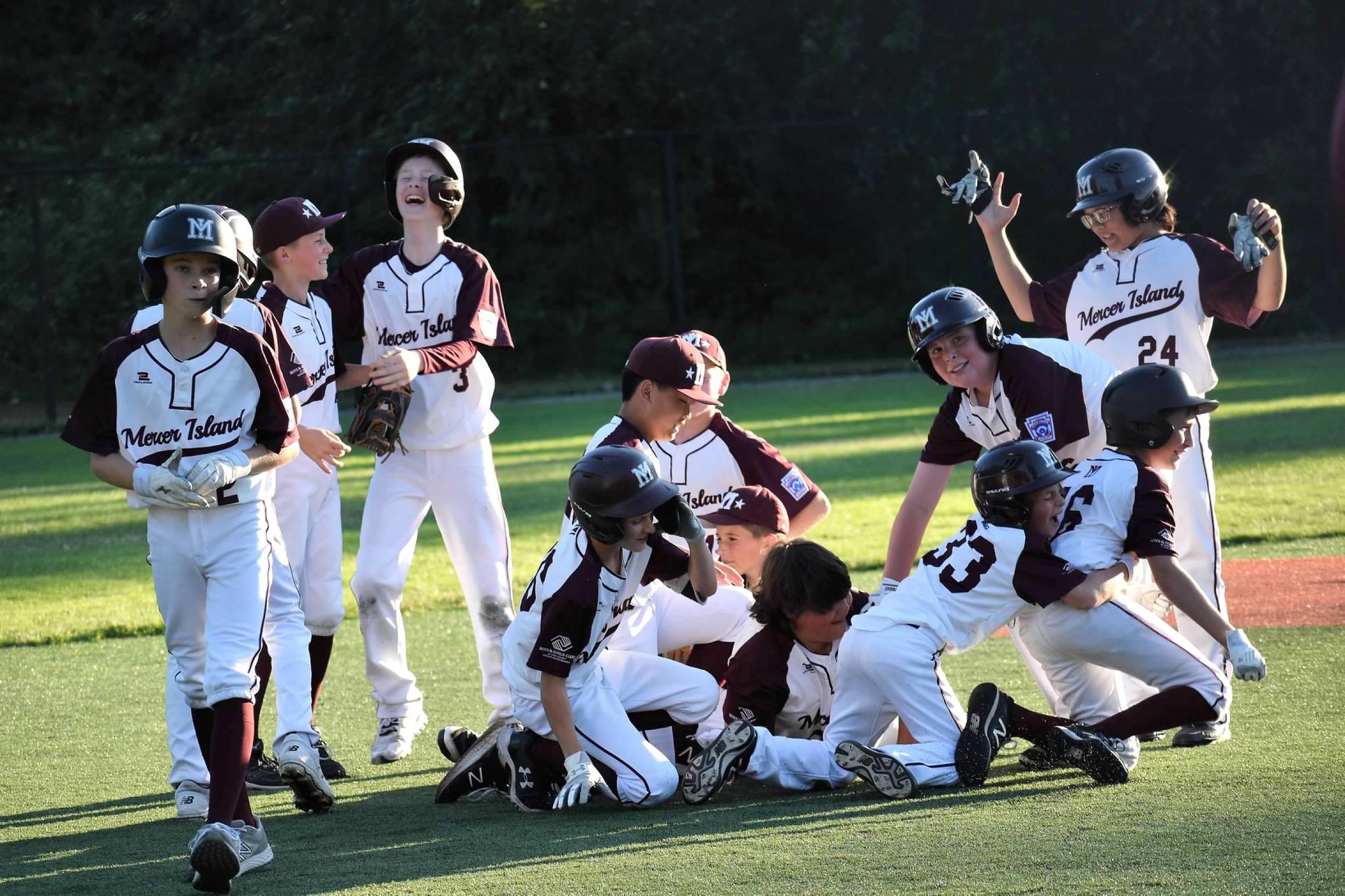 The Mercer Island Little League majors all-star team lost to Eastlake, 11-10, in game two of the District 9 final on July 12. The second-place local squad won its first three games of the double-elimination tournament over Bellevue Thunderbird (18-3), Sammamish (18-1) and Eastlake (4-3) at South Mercer Playfields. Mercer Island faced Eastlake twice more — after Eastlake advanced through the losers bracket — for the championship, with the locals losing both games. Eastlake won game one in extra innings, 8-6, to set up the final game. Pictured are Mercer Island players dog-piling to celebrate their victory over Eastlake on July 9. Eastlake won the state championship on July 26 over Lake Stevens, 6-0. The team is: Ben Shleifer, Brady Dolence, Brady Mock, Cash Little, Chase Kelly, Dash Dahlberg, Ethan Nguyen, Ewan Shea, Joey Weiss, Liam Sirianni, Lucas Kornylo, Mattias Hofstetter, Theo Roodman and coaches Eric Dahlberg, Jay Shleifer and Casey Little. Photo courtesy of Kym Otte