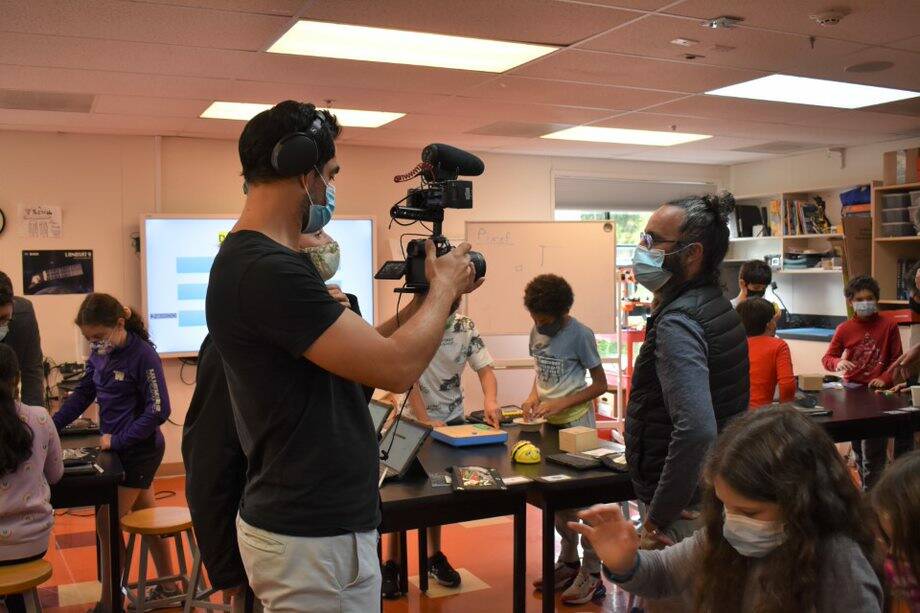 M6 film crew members interview Khalid Amali, the French American School of Puget Sound’s lower school head, on Oct. 4 on the Mercer Island school’s campus. Photo courtesy of the French American School of Puget Sound