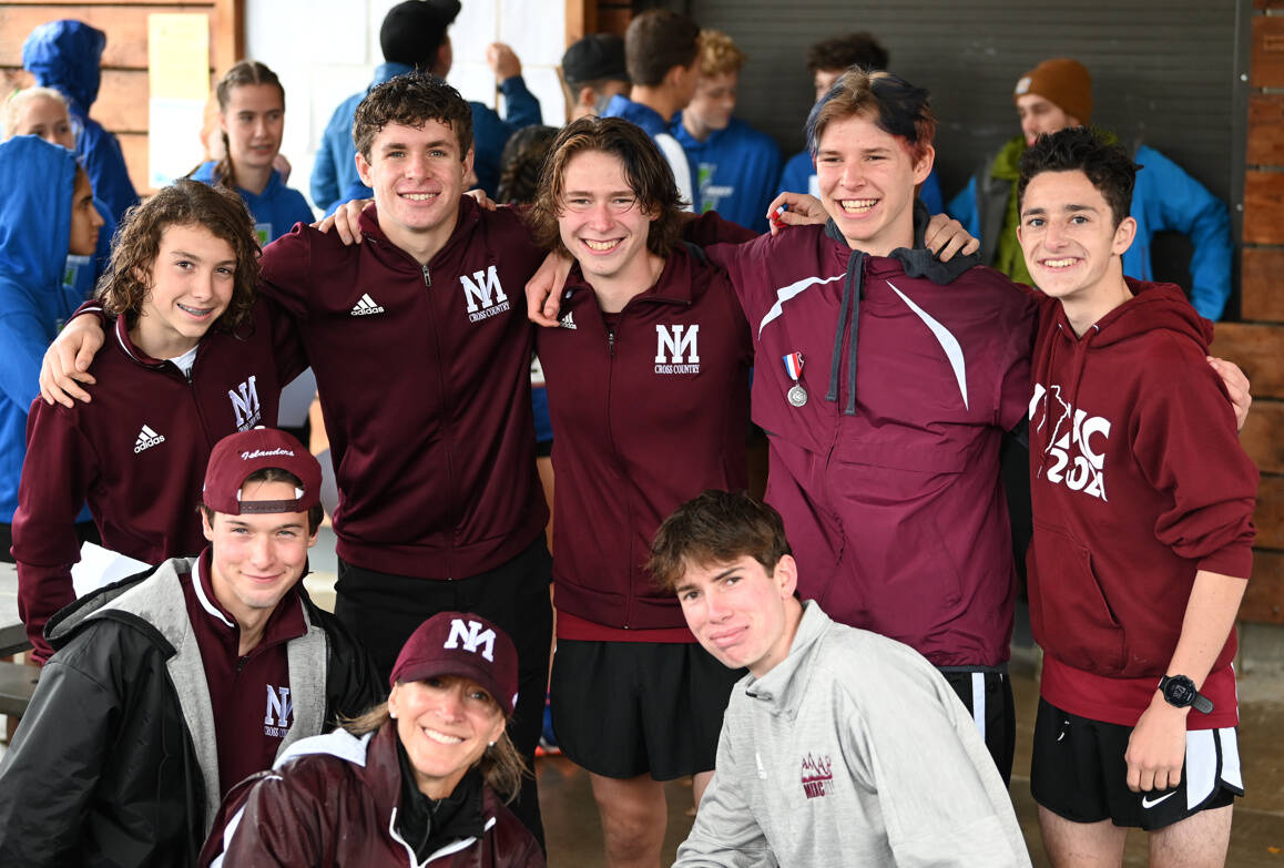 Mercer Island High School boys cross country 3A KingCo champs: From left to right, top row, Owen Powell, Brooks Enge, Ryan Koopman, Clark Koopman and Alex Levin; and bottom row, Luke Sandmaier, head coach Susan Empey and Kai Zettel. Courtesy photo