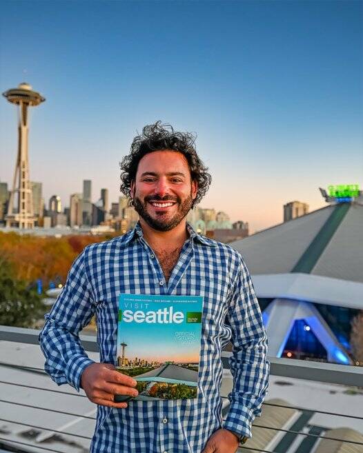 Mercer Island High School alumnus Andrew Meade continues his photographic journey with a second consecutive cover shot for the Visit Seattle magazine. His images are also featured in a “Seattle Exceptional Architecture” article within the publication. In other projects, Meade shot a University of Washington football stadium promotional video, aerial photography and was featured in the opening day program; and he took Space Needle pictures of the FIFA World Cup 2026 flag that the city hoisted on Nov. 1. FIFA officials are evaluating Seattle as a possible host city for matches. For more information, visit Meade’s site Andrew Jacob Media at https://andrewjacobmedia.com/. Photo courtesy of Sophia Ciserella