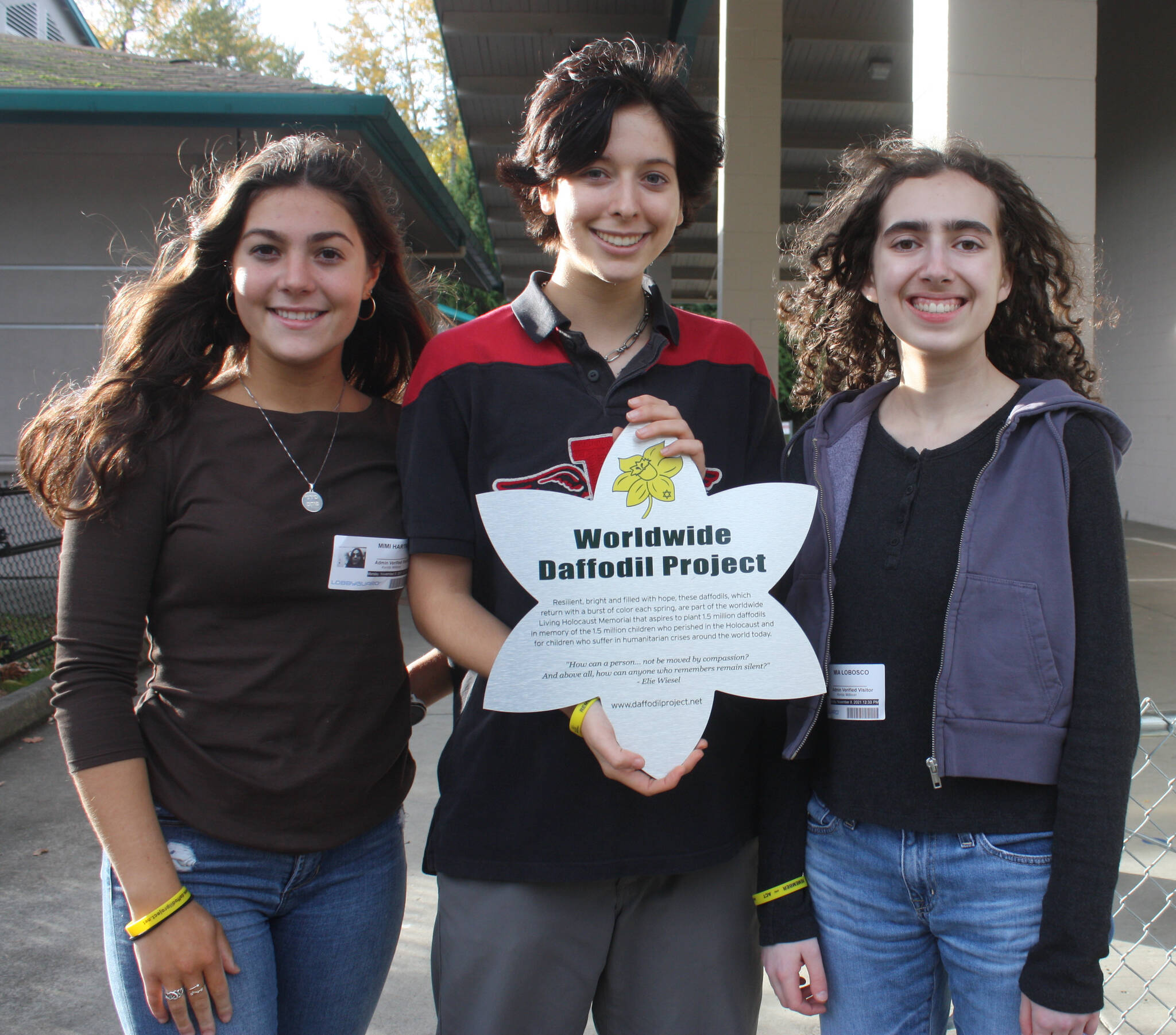 From left, Mercer Island High School’s Mimi Hartman, Devon Benaroya and Mia LoBosco are members of the student-led Holocaust Education Committee. They worked on the Worldwide Daffodil Project with Island Park Elementary School students on Nov. 8. Andy Nystrom/ staff photo