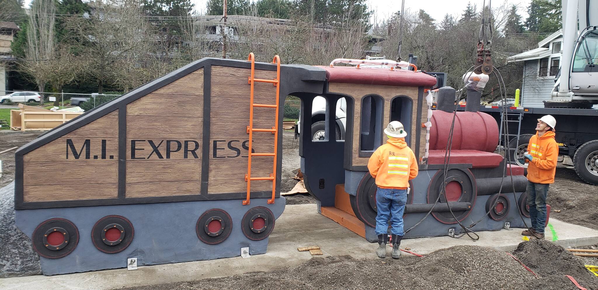 On Dec. 10, the long-awaited new train sculpture arrived and was lifted into place at the Mercerdale Park playground. Each section weighs 12,500 pounds and will be accessible to wheelchairs in the center. Other new playground equipment is slated to be delivered in mid-December, and the playground grand opening will likely be held in early 2022, according to the city. Photo courtesy of John Hamer