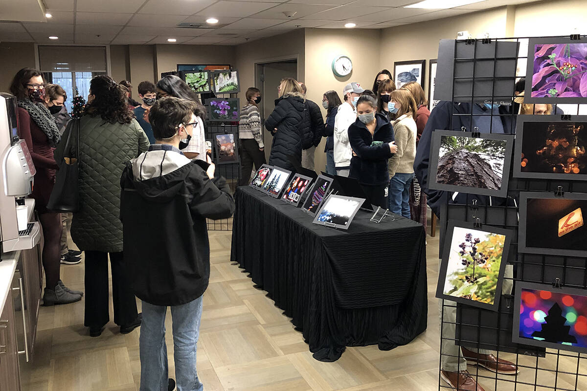 Island House recently hosted an art show featuring photos from Mercer Island High School students. At the event, Mac McQuade also collected donations for the Downsizing Network.