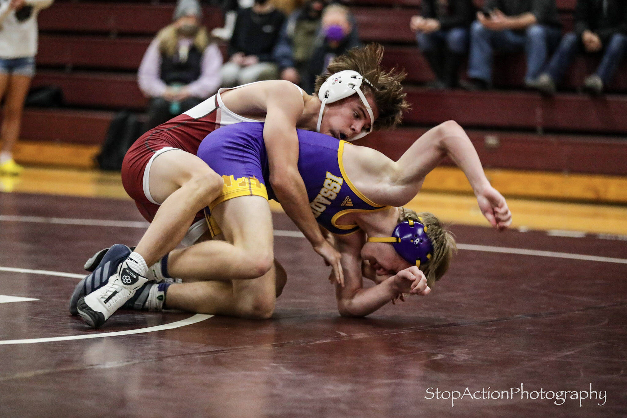 Mercer Island’s Maxwell Martin, top, gets a hold on Issaquah’s Quin Seiffert during a 138-pound match on Jan. 6. Martin defeated Seiffert by minor decision, 7-1. Mercer Island topped Issaquah, 32-27, and Mount Si beat Mercer Island, 42-37, in the double-dual. Other Mercer Island winners on the night were Gordon Gibson (120), Lincoln Woods (126), Chase Warnick (145), Clark Koopman (152), Jack Levitt (170), Leo Garry (106) and Magnus Dorre (113). Photo courtesy of Don Borin/StopActionPhotography