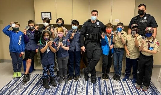 Mercer Island Police Department corporal Bobby Jira and officer Nick Palandri recently welcomed members of Cub Scout Pack 624 for Sticker Day. Each troop member received a police department sticker and talked with officers about what their jobs are like in the community. Photo courtesy of the Mercer Island Police Department