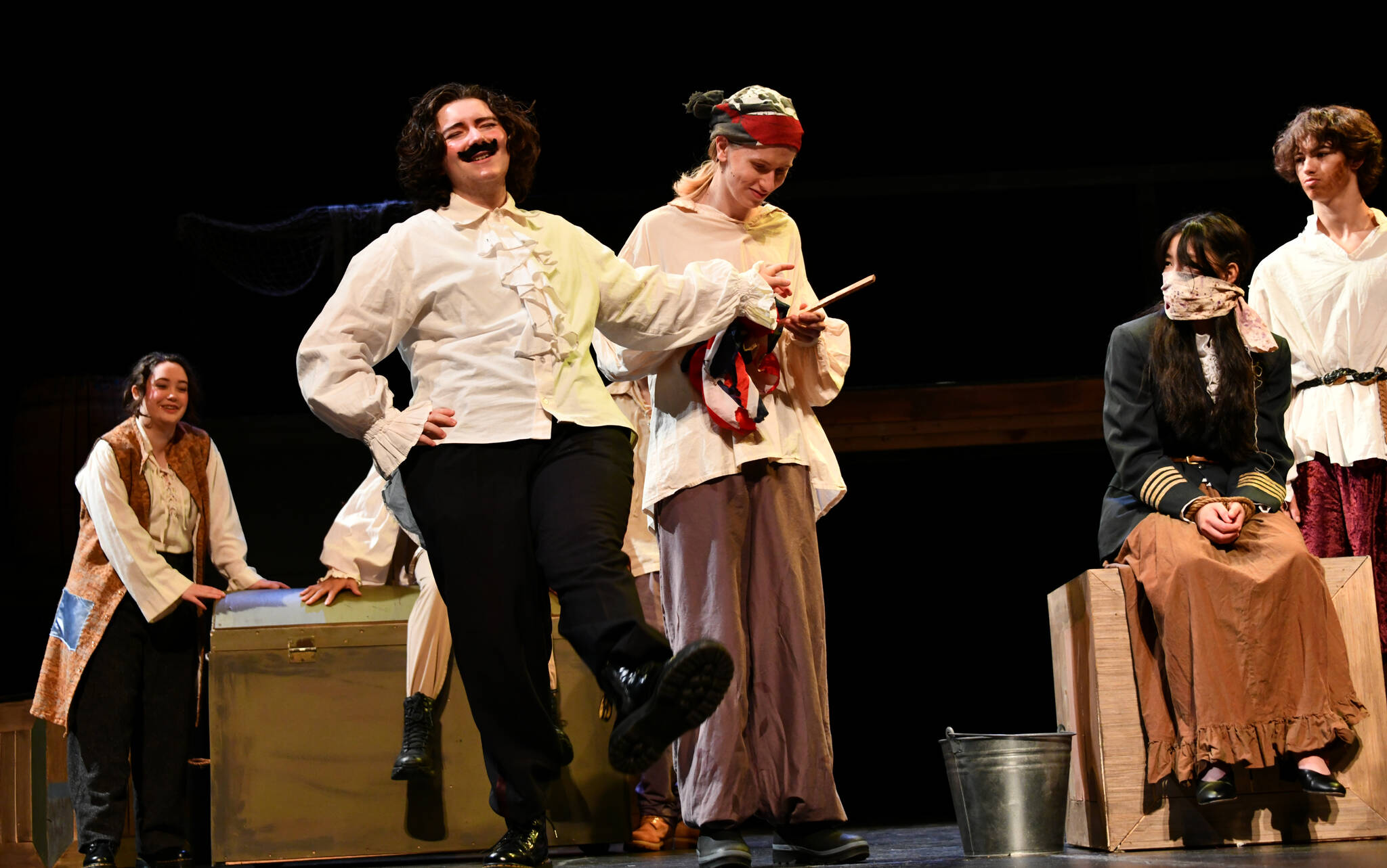 Mercer Island High School actors run through a dress rehearsal of “Peter and the Starcatcher” on Jan. 26. The Neverland cast actors, are, from left to right, Kate Petersen, Milo Mechem-Miller, Christopher Burnside, Madi Chew and Max Taylor. Andy Nystrom/ staff photo